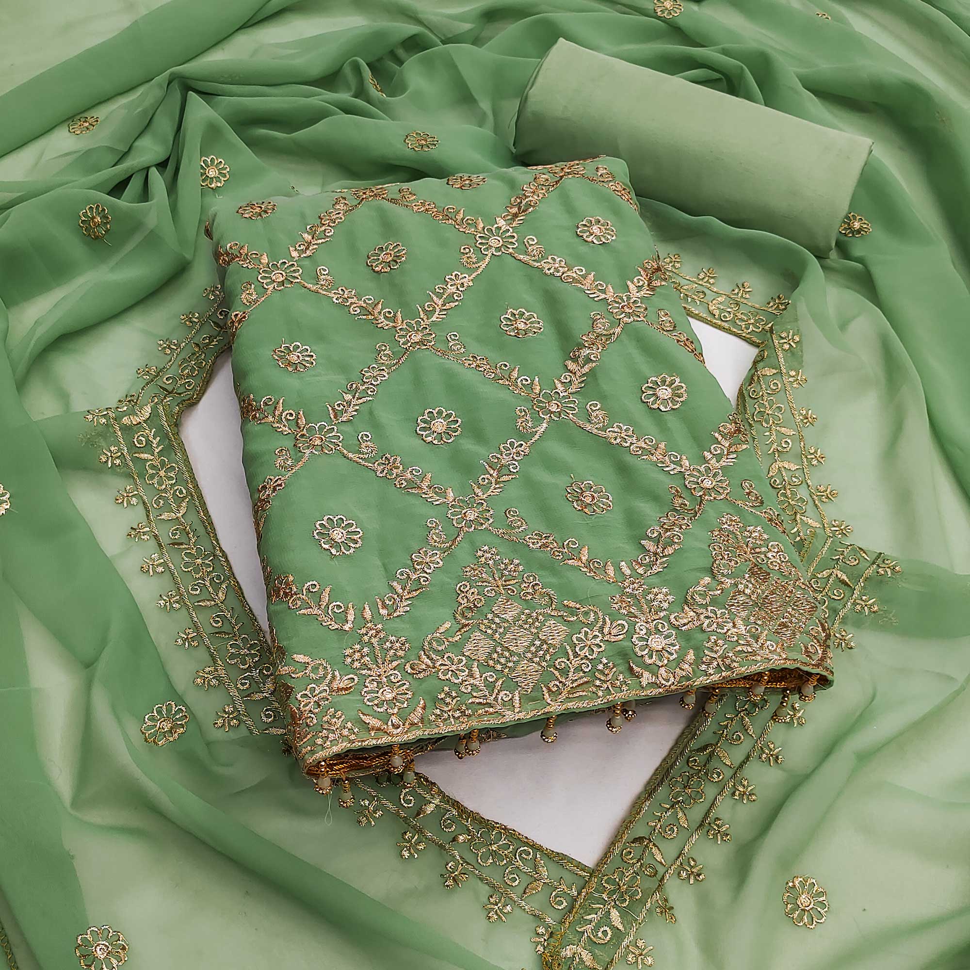 Green Georgette Dress Material Adorned With Floral Zari Embroidery Work