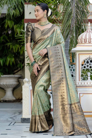 Green Kanjivaram Silk Saree Showcasing Floral Meenakari Zari Weaving With Elegant Piping & Tassels