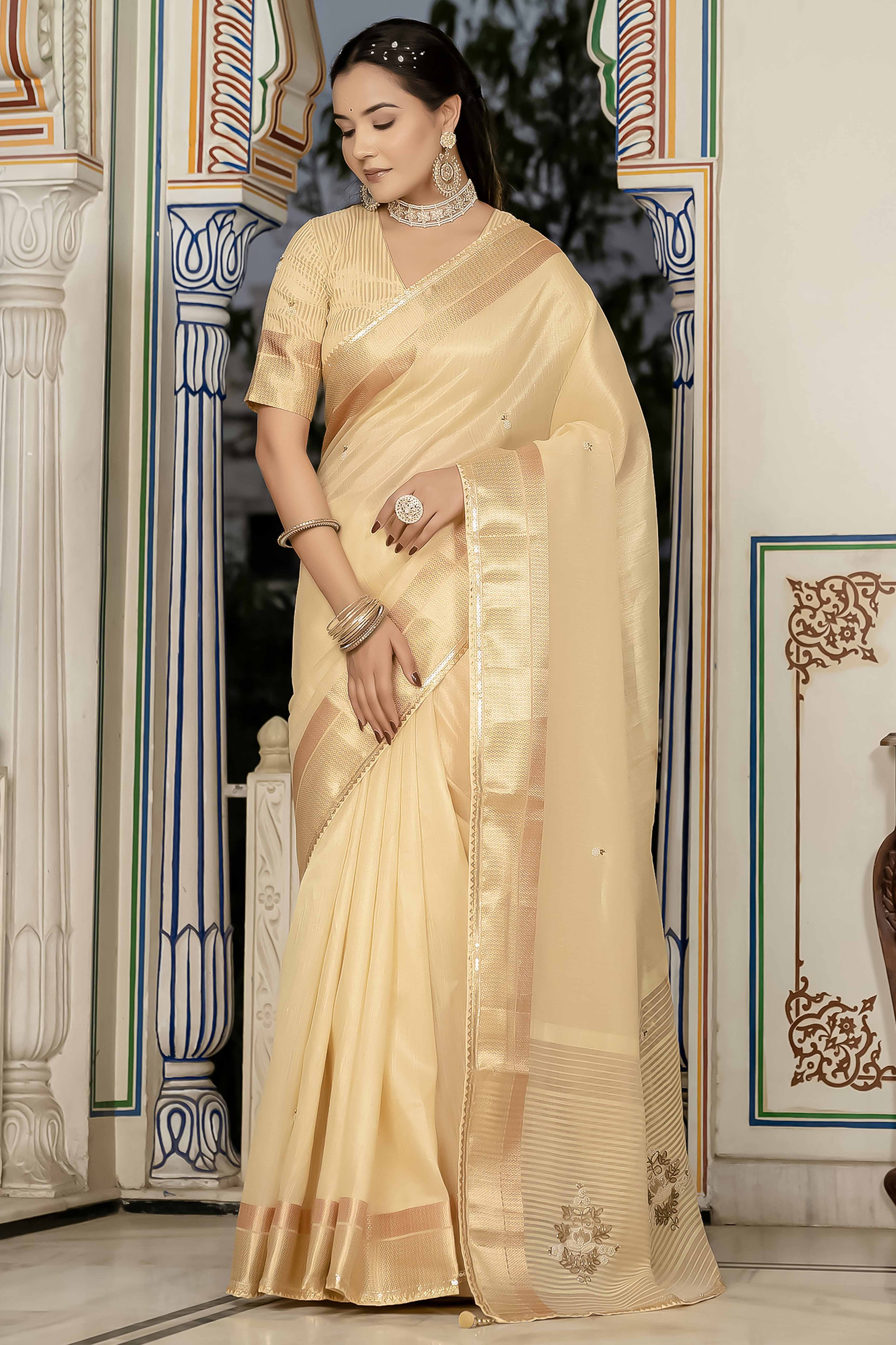 Beige Tissue Linen Saree Featuring Intricate Zari and Beadwork
