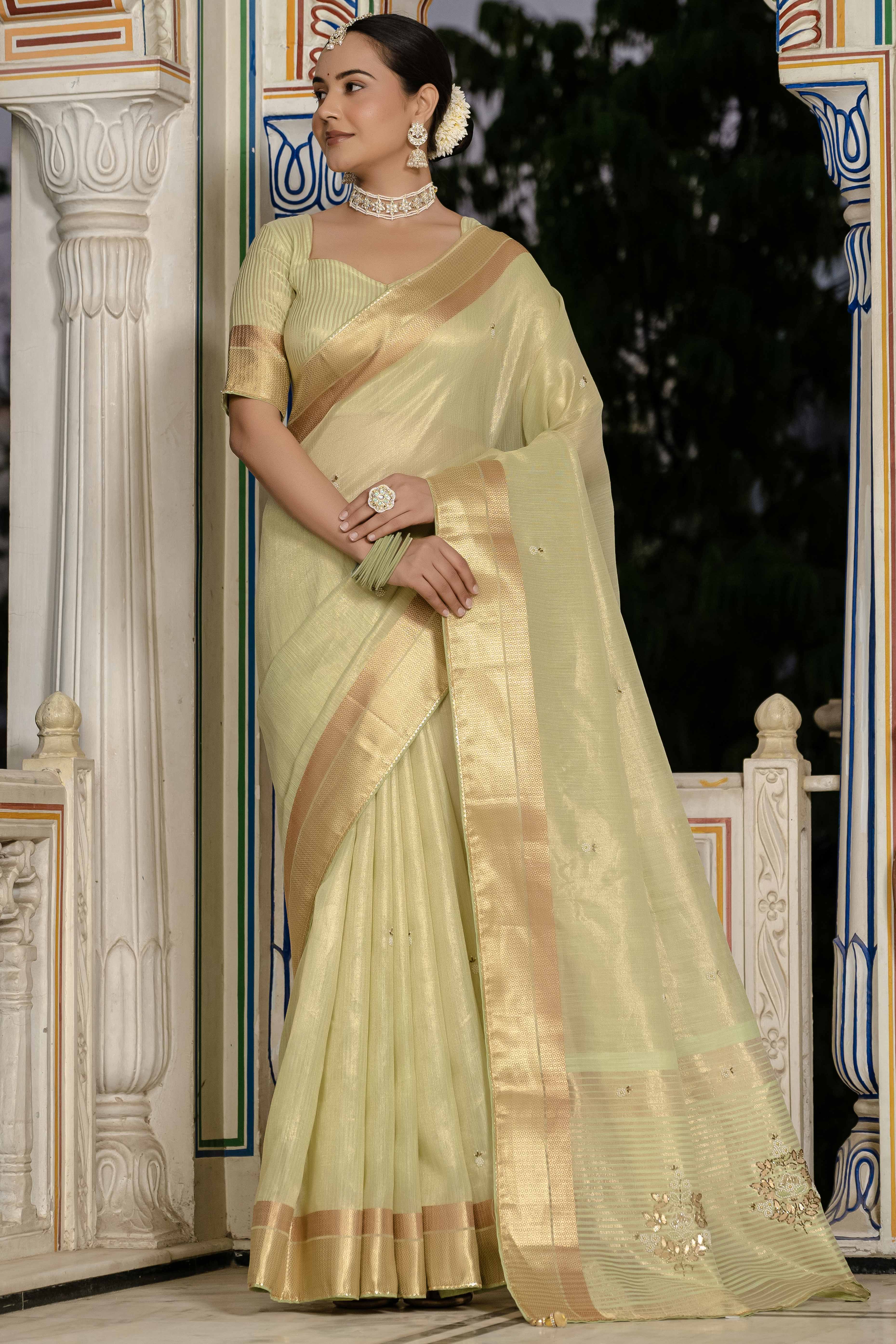 Green Tissue Linen Saree Featuring Intricate Zari and Beadwork