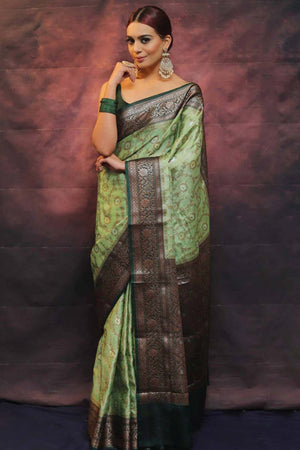Elegant Green Floral Zari Woven Lichi Banarasi Silk Saree With Intricate Detailing
