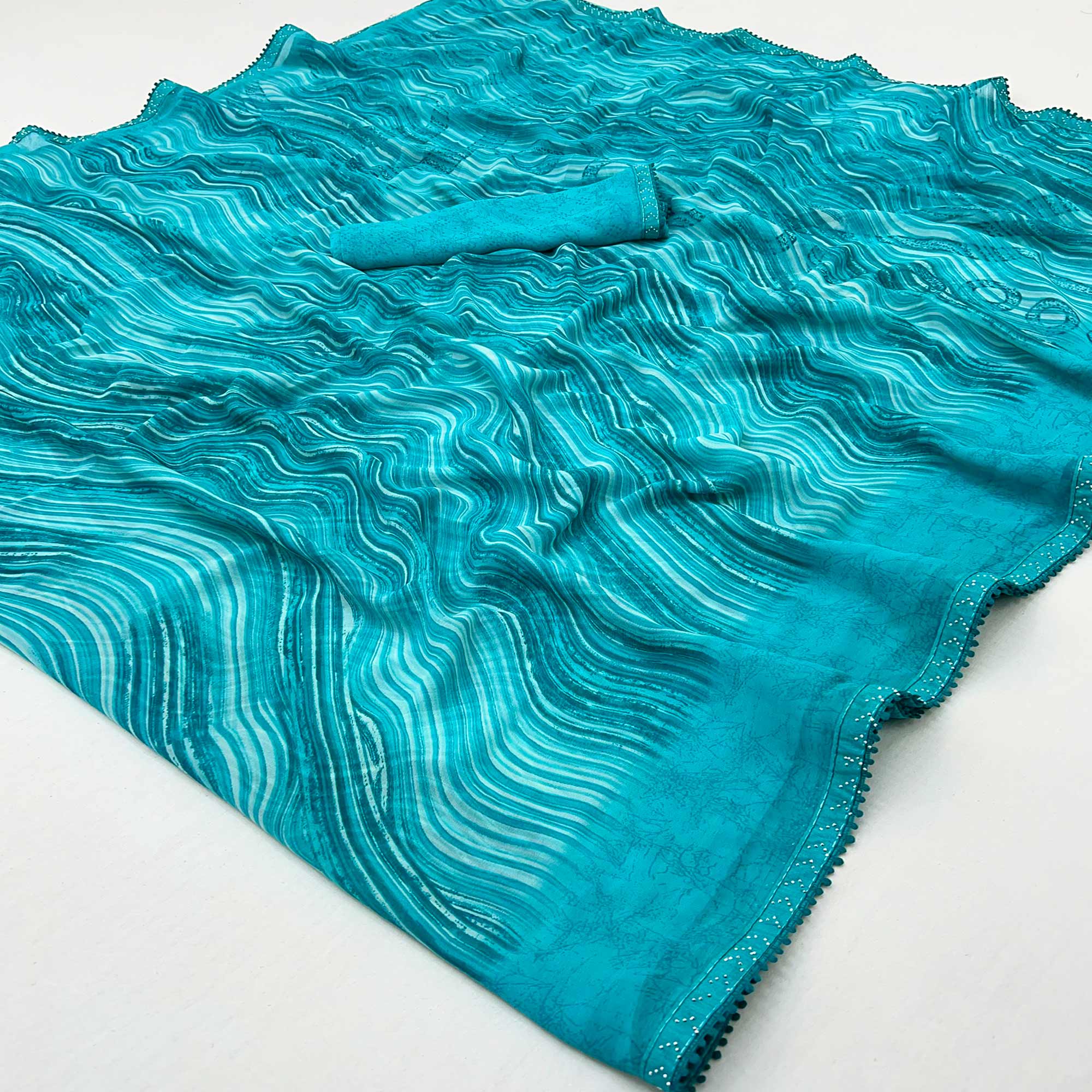 Blue Printed Georgette Saree With Fancy Lace Border