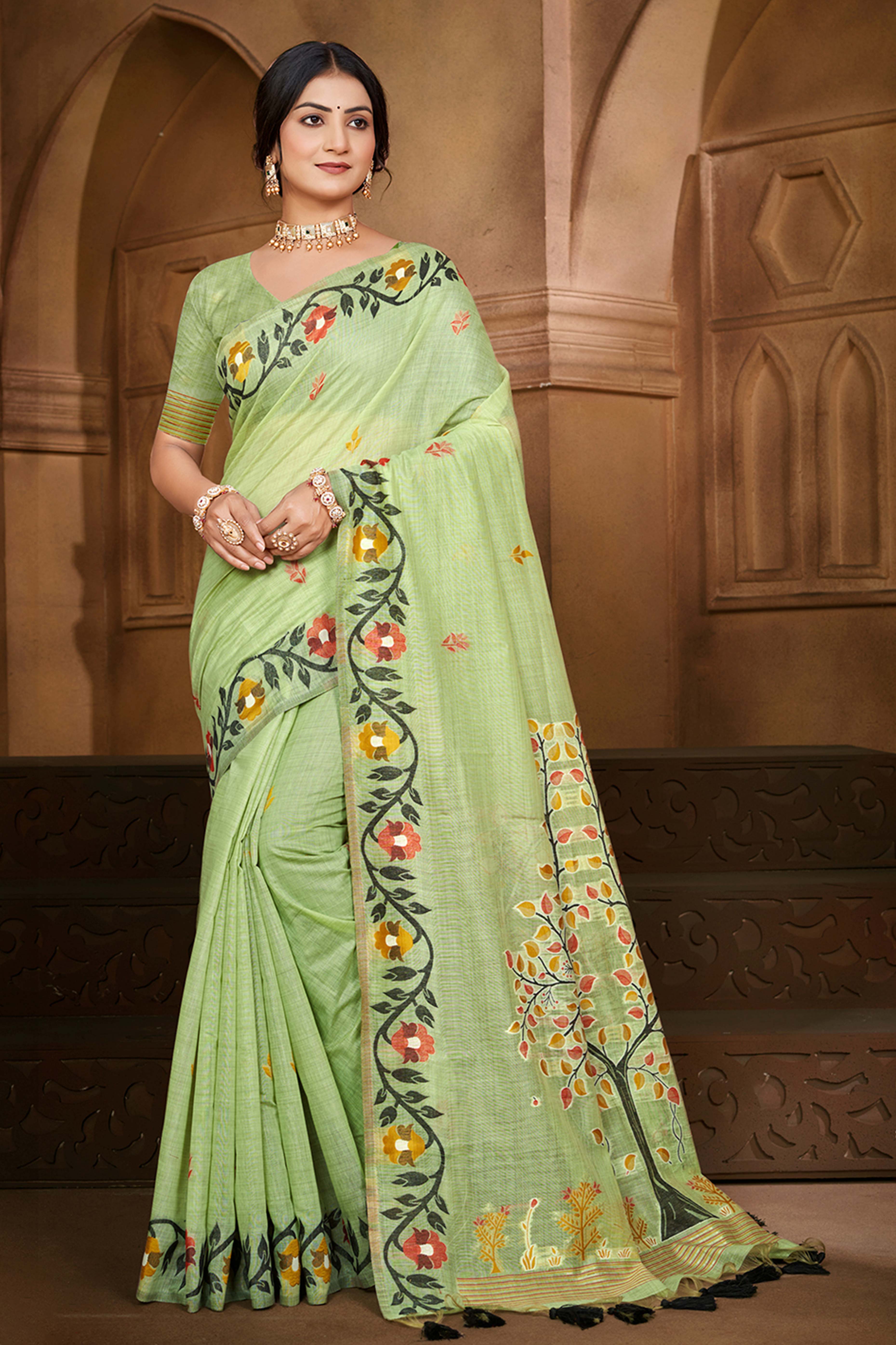 Charming Green Floral Weaving Cotton Silk Saree Enhanced With Tree Motif Pallu With Tassel