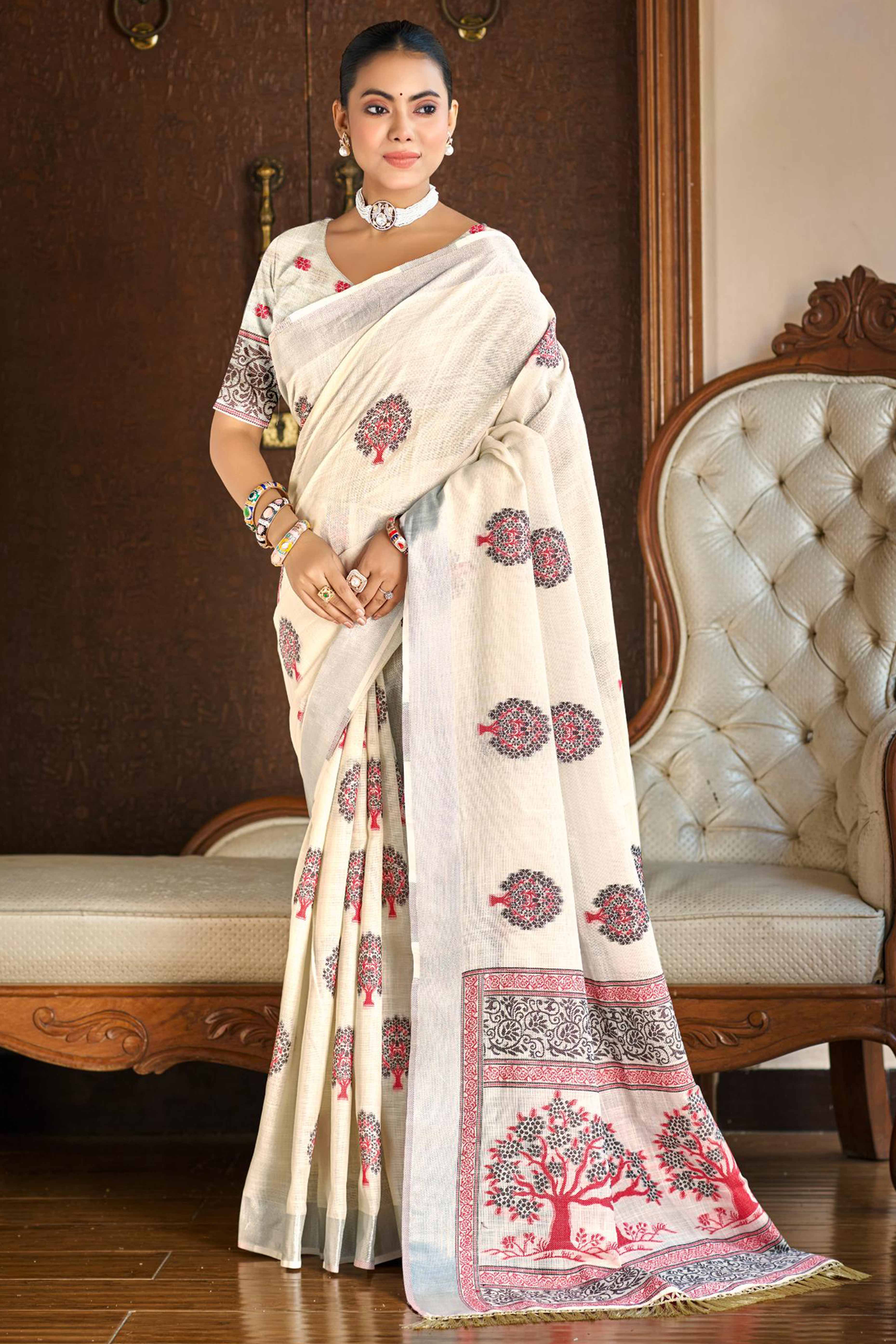 Cream Linen Saree Adorned With Intricate Zari Weaving & Tassel Pallu