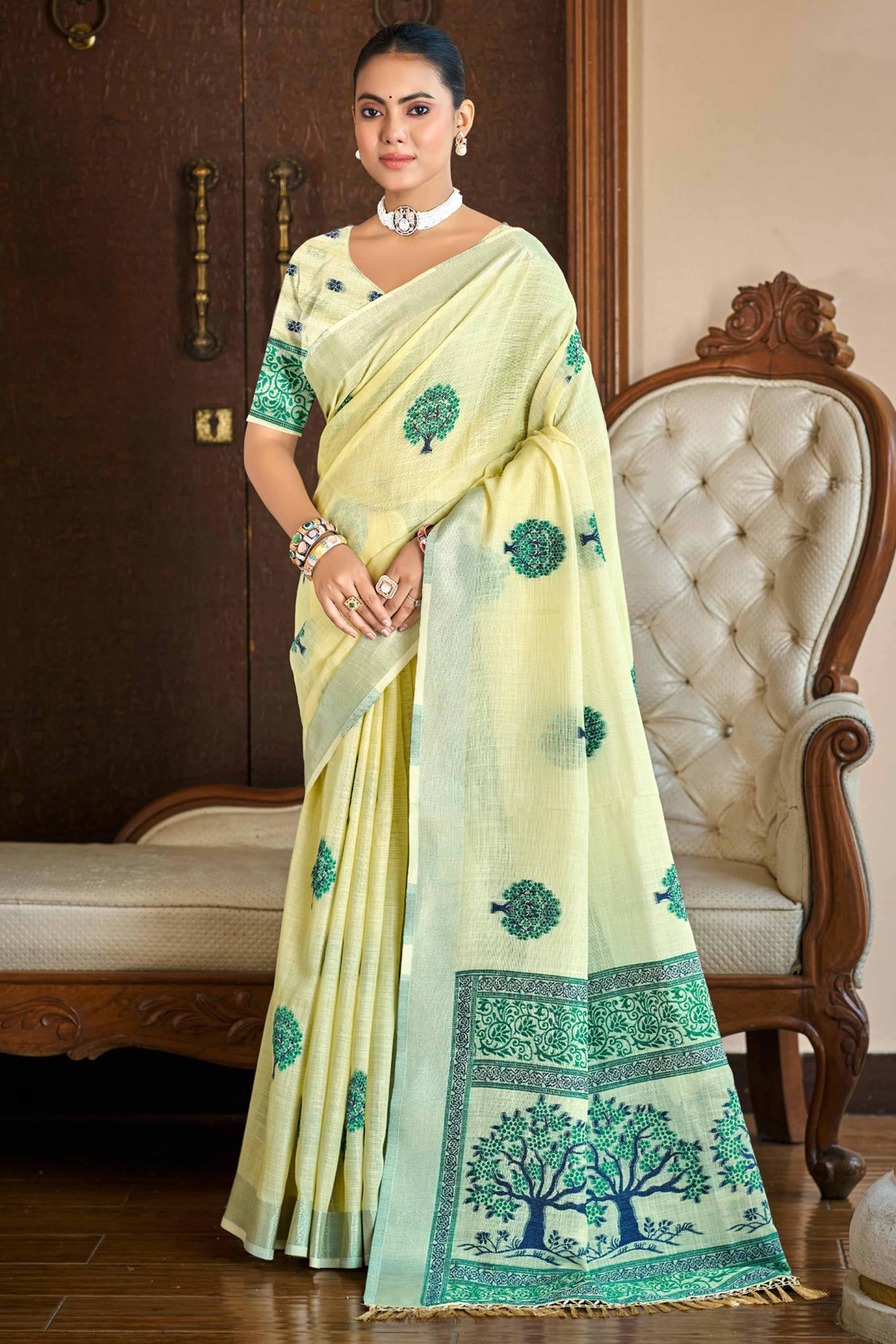 Yellow Linen Saree Adorned With Intricate Zari Weaving & Tassel Pallu