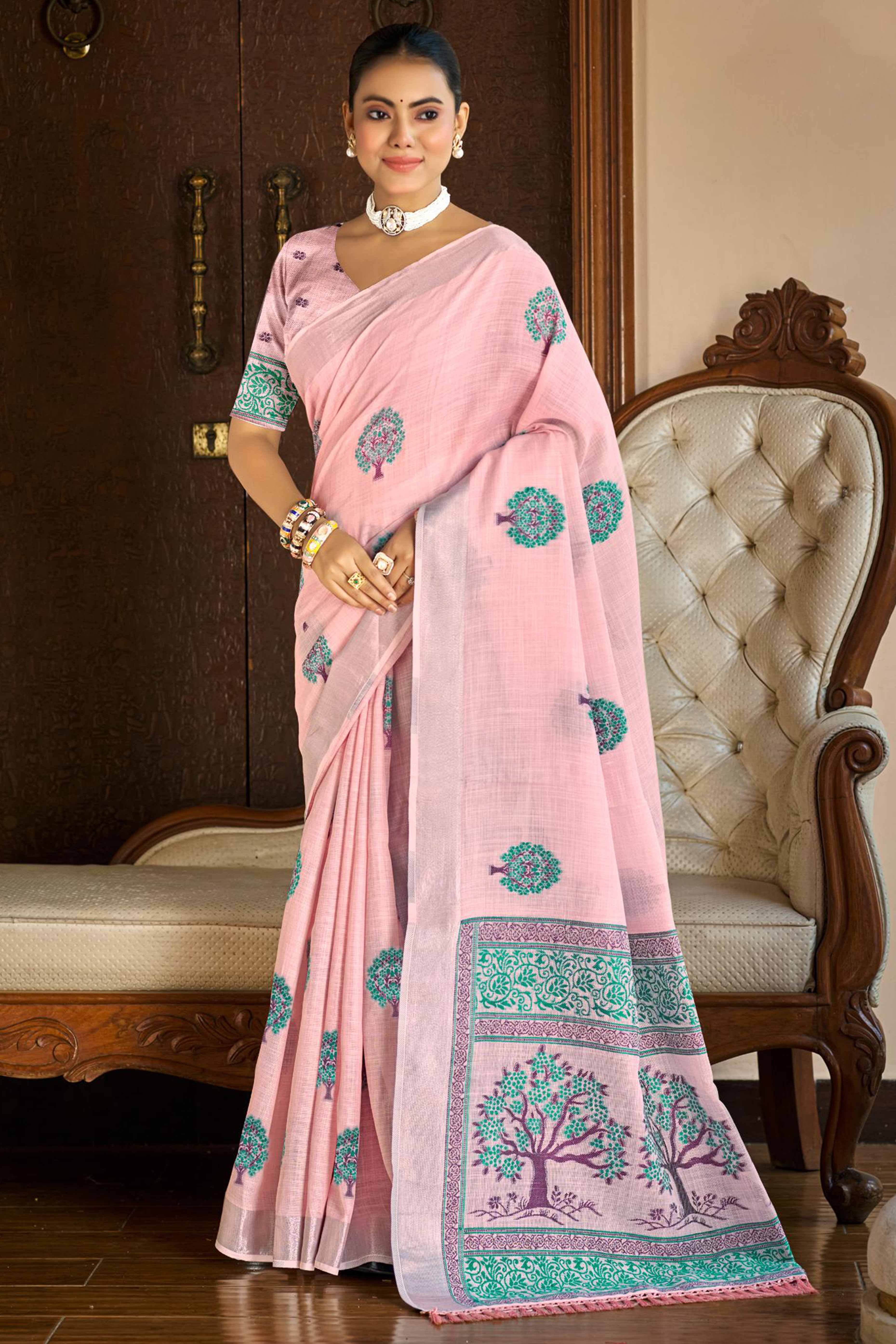 Pink Linen Saree Adorned With Intricate Zari Weaving & Tassel Pallu