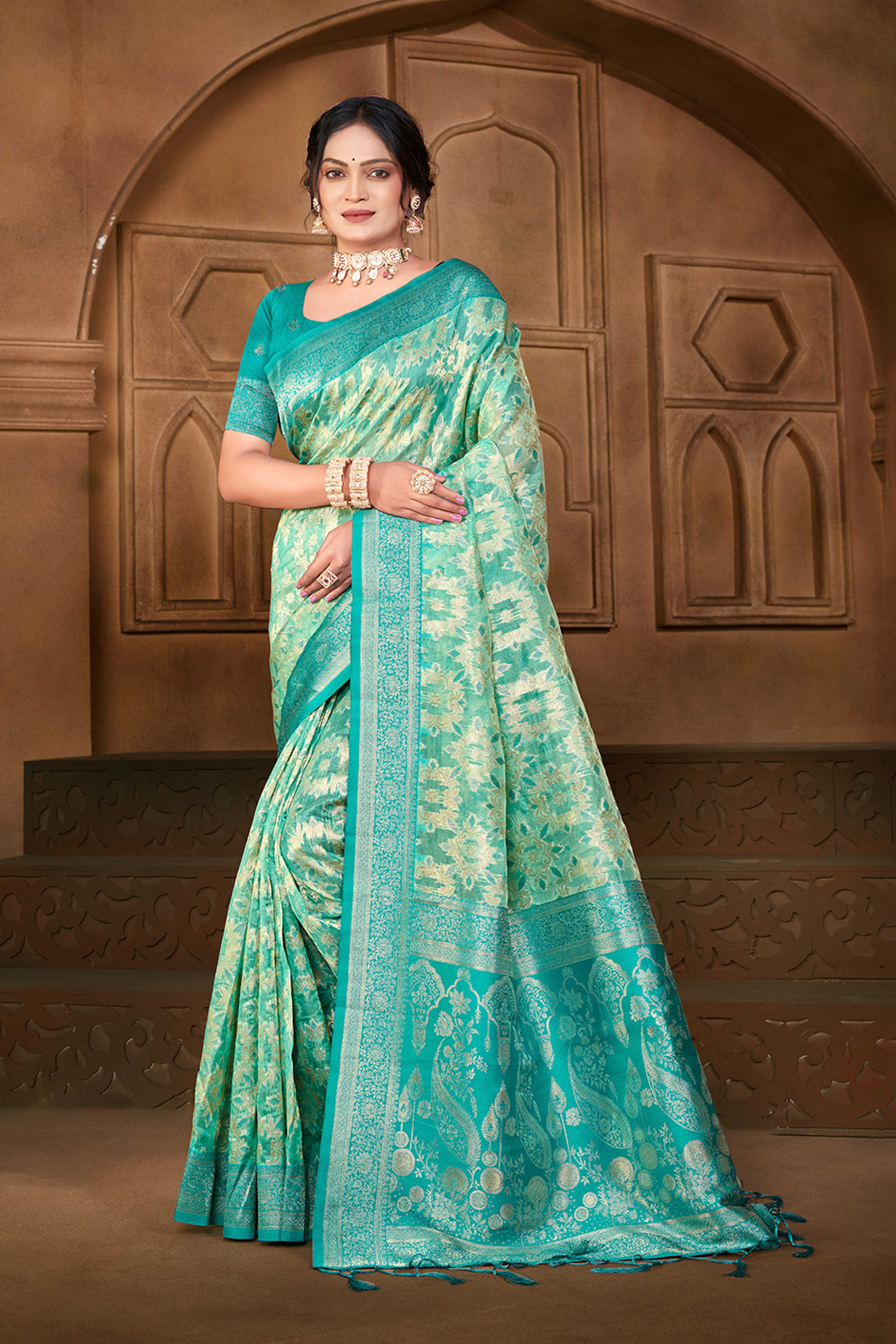 Stunning Turquoise Blue Floral Weaving Silk Blend Saree Enhanced With A Stylish Tassel Pallu