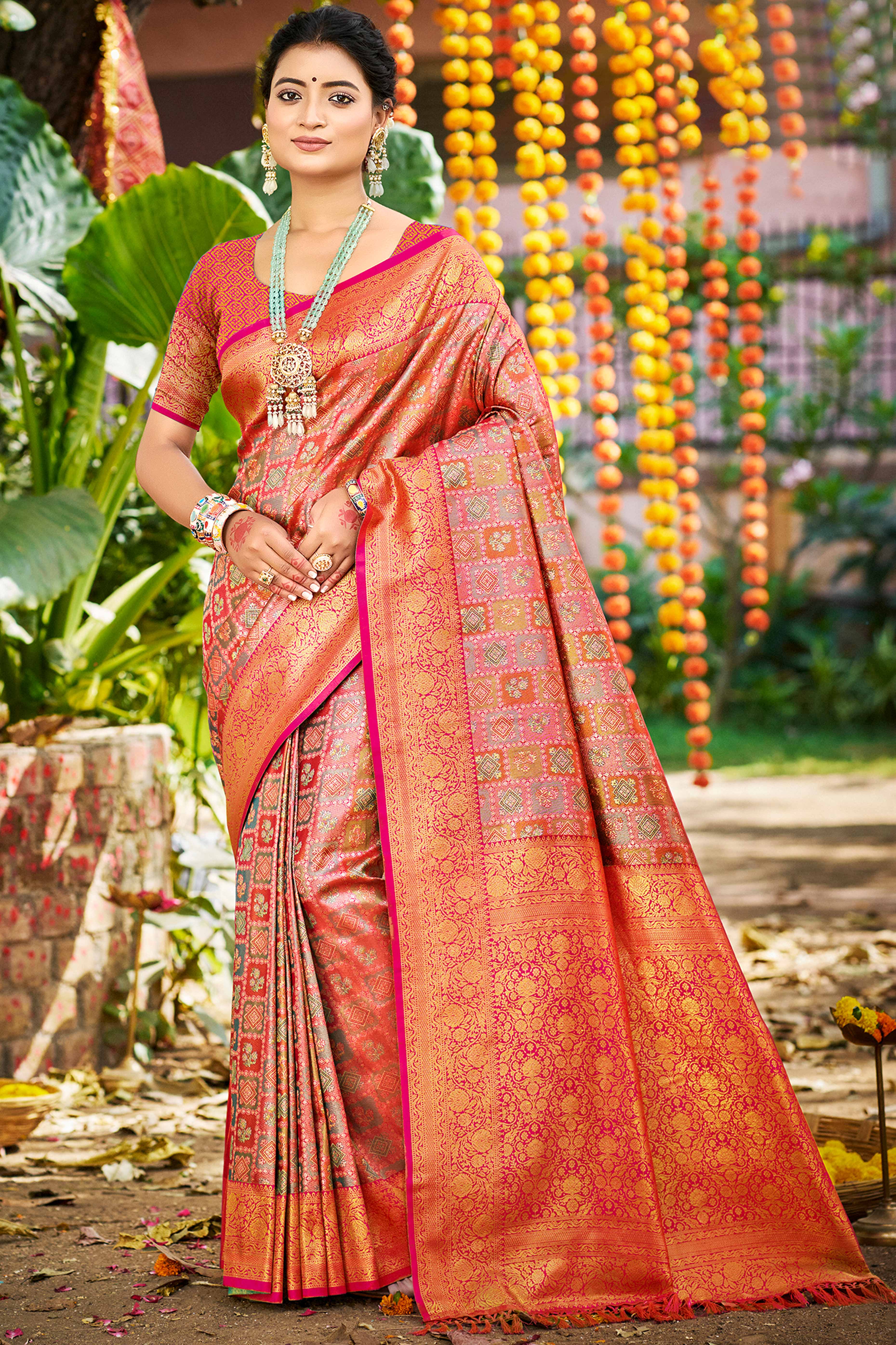Pink Silk Blend Dharmavaram Saree Featuring Ornate Floral Weaves & Tassels Pallu