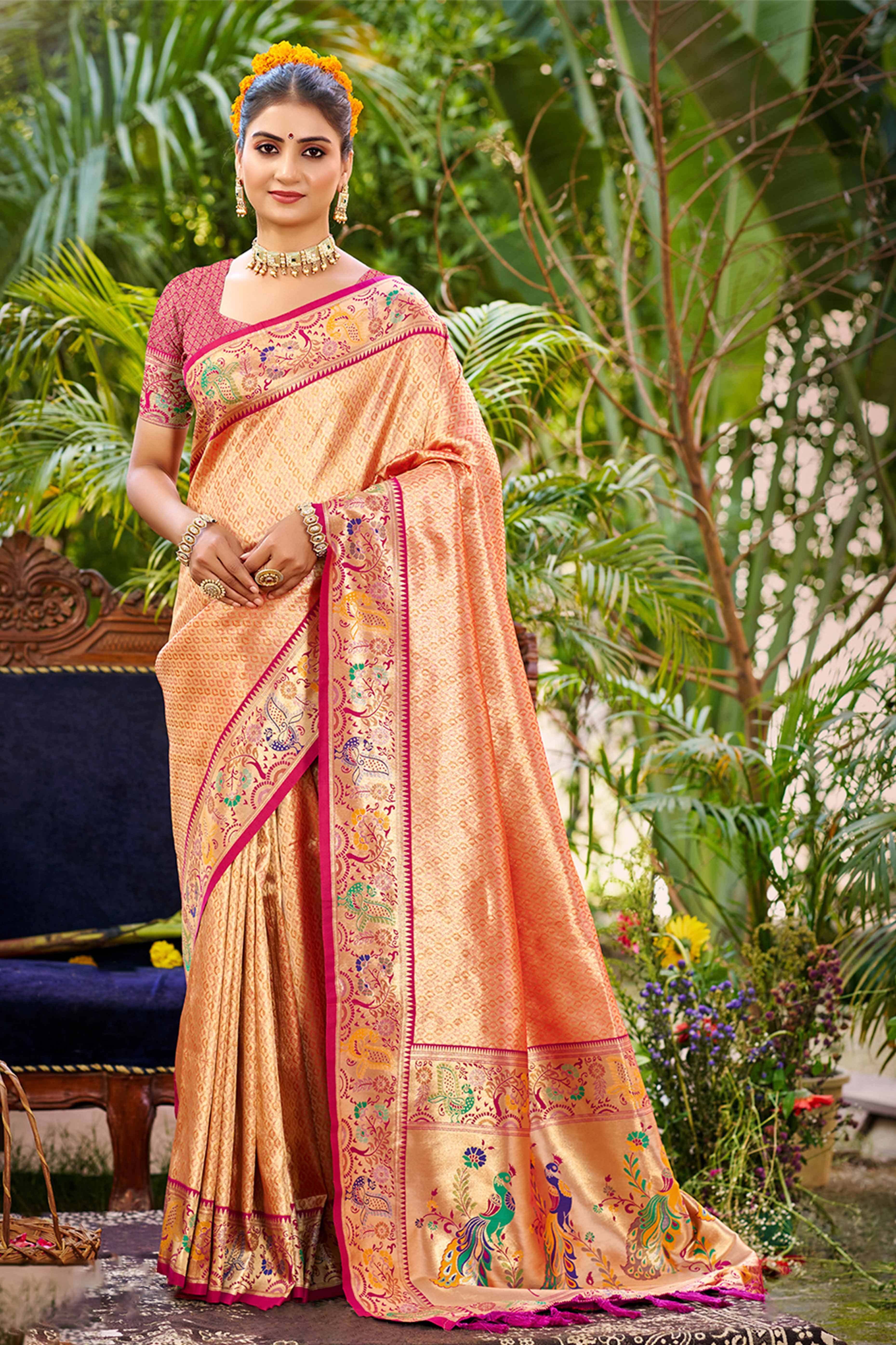 Graceful Orange Silk Blend Saree Adorned With Intricate Zari Weave & Peacock Motif Pallu