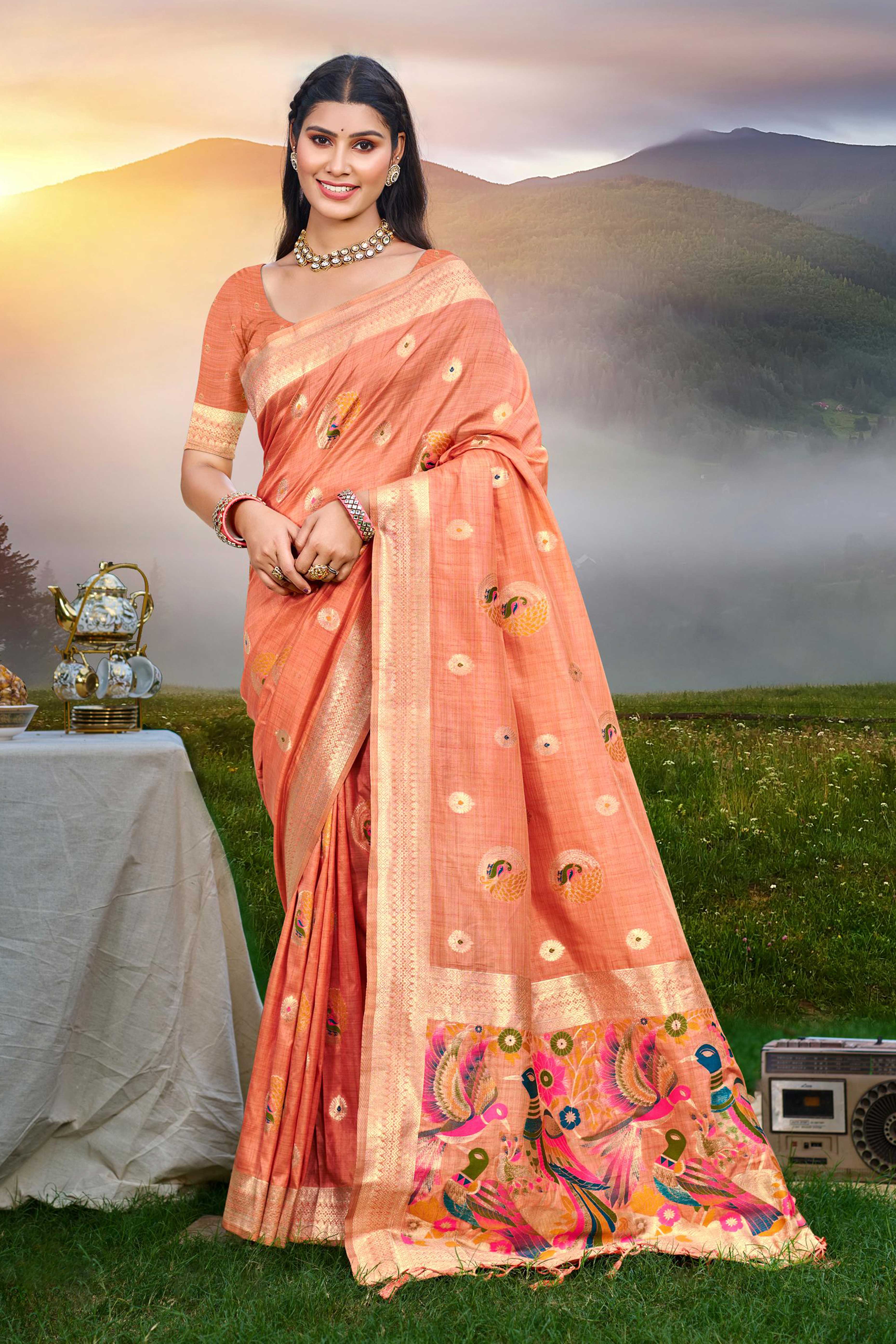 Designer Light Orange Assam Silk Blend Saree Adorned With Peacock Zari Weaving & Tassel Pallu