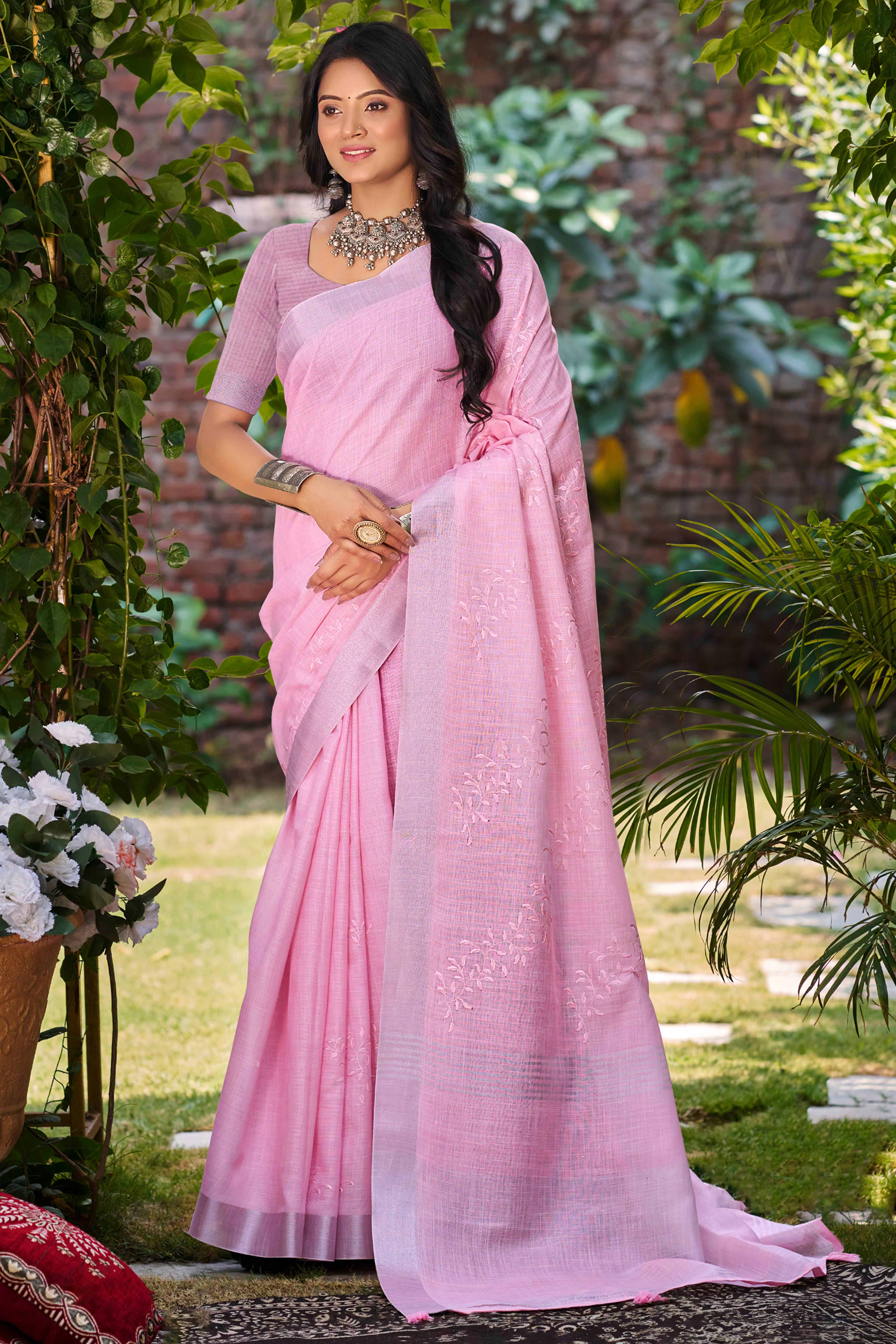 Elegant Dark Pink Linen Saree Featuring Intricate Woven & Embroidered Patterns