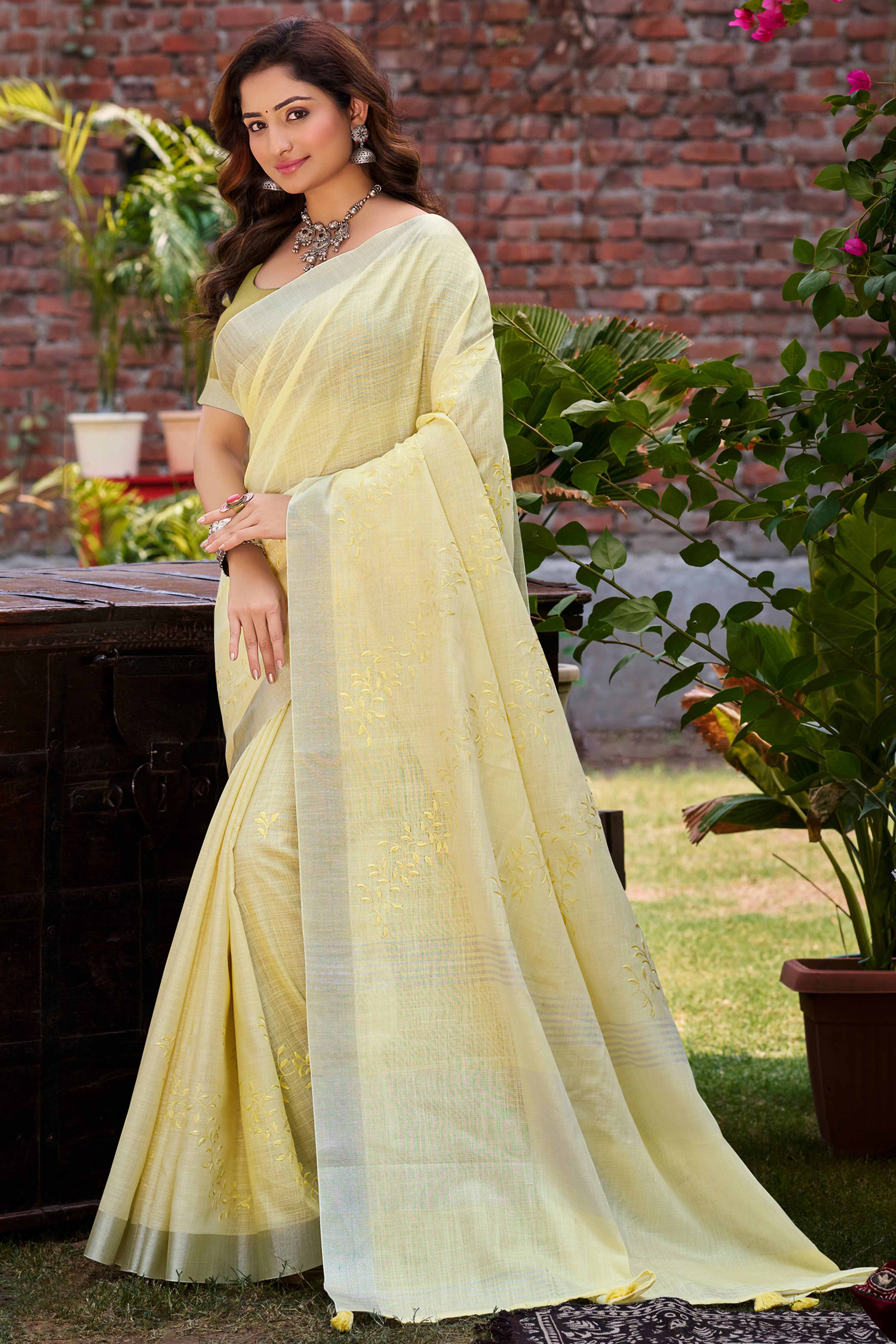 Elegant Yellow Linen Saree Featuring Intricate Woven & Embroidered Patterns