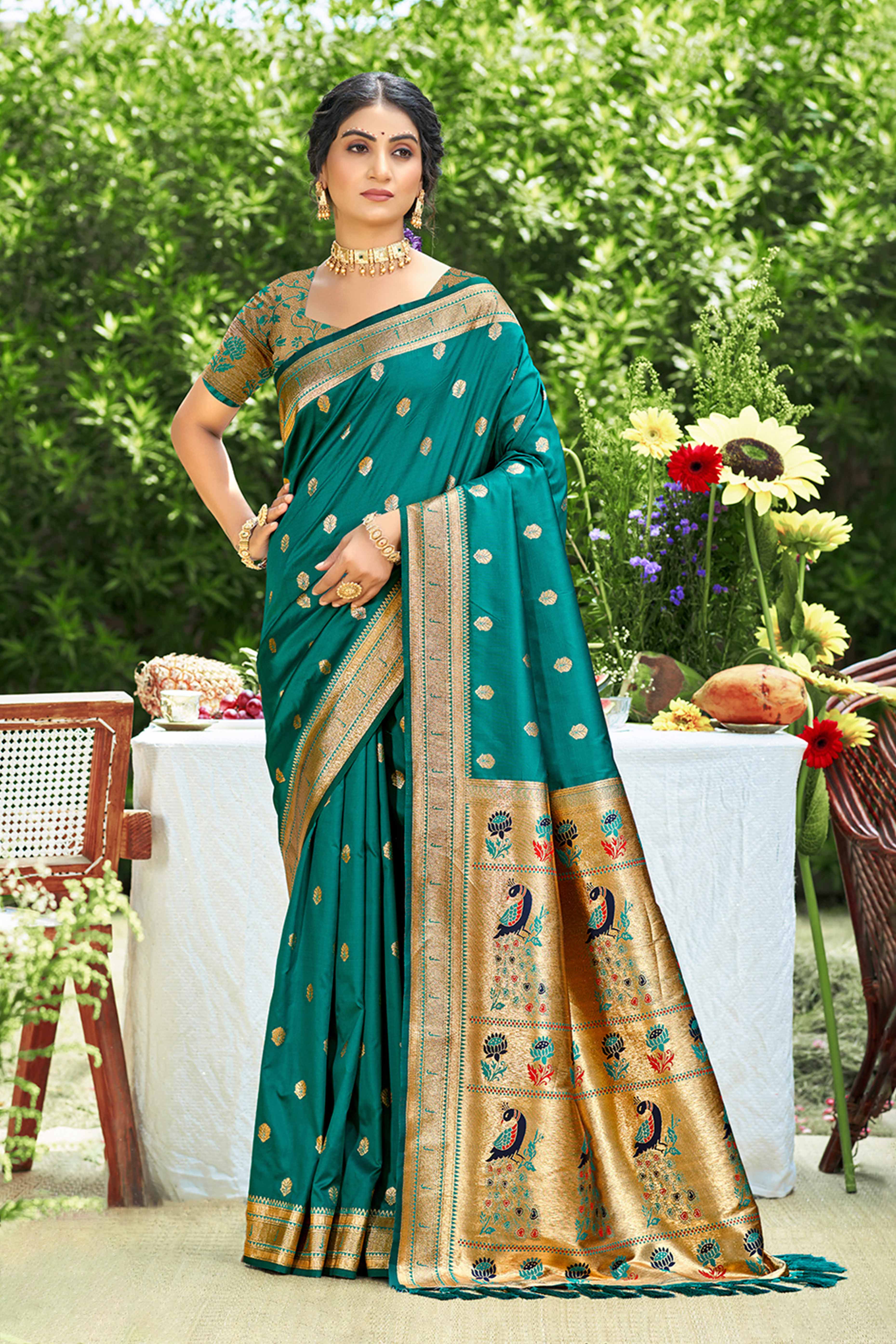 Teal Zari Weaving Silk Blend Saree Adorned With Intricate Peacock Motif Pallu & Graceful Tassel