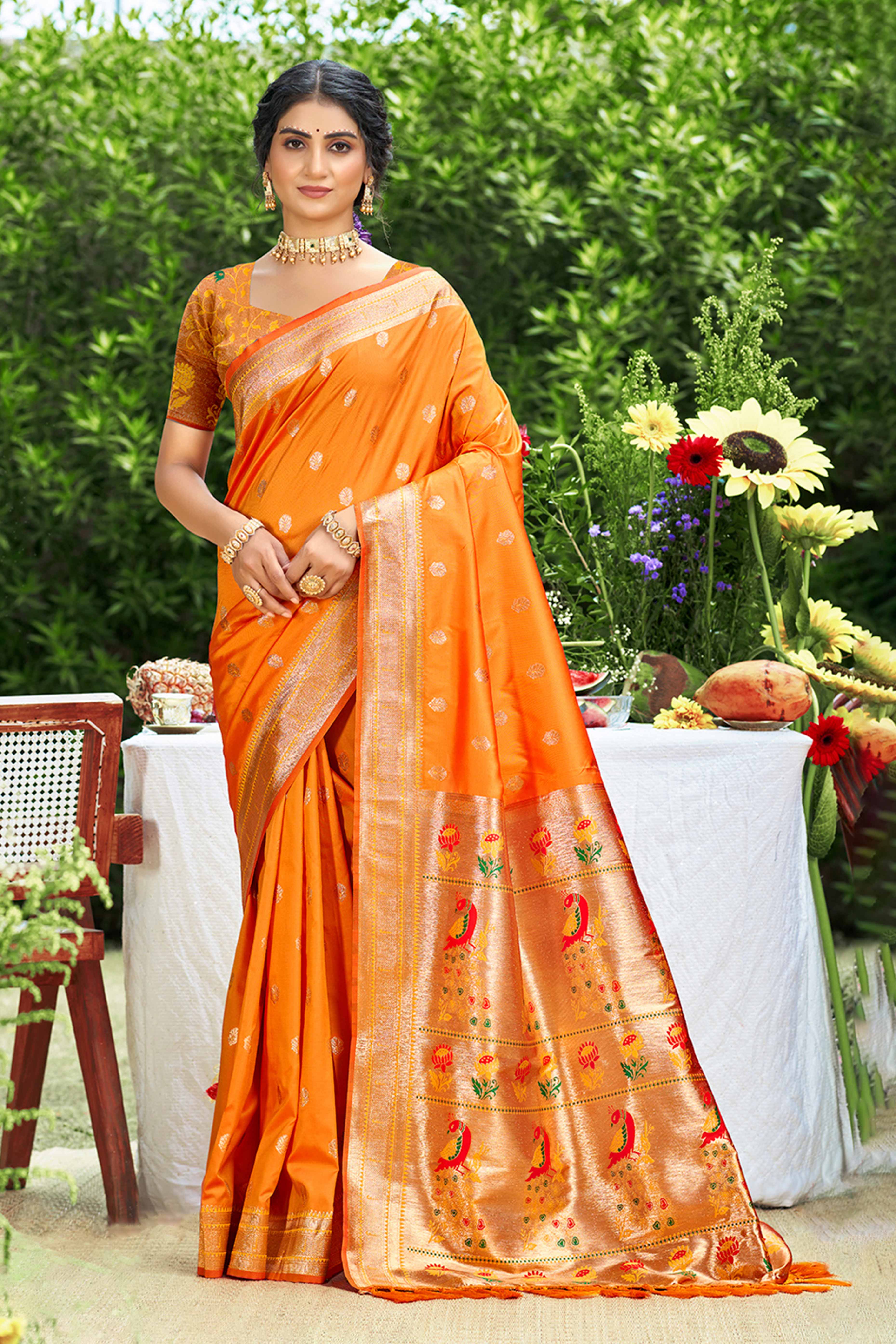Orange Zari Weaving Silk Blend Saree Adorned With Intricate Peacock Motif Pallu & Graceful Tassel