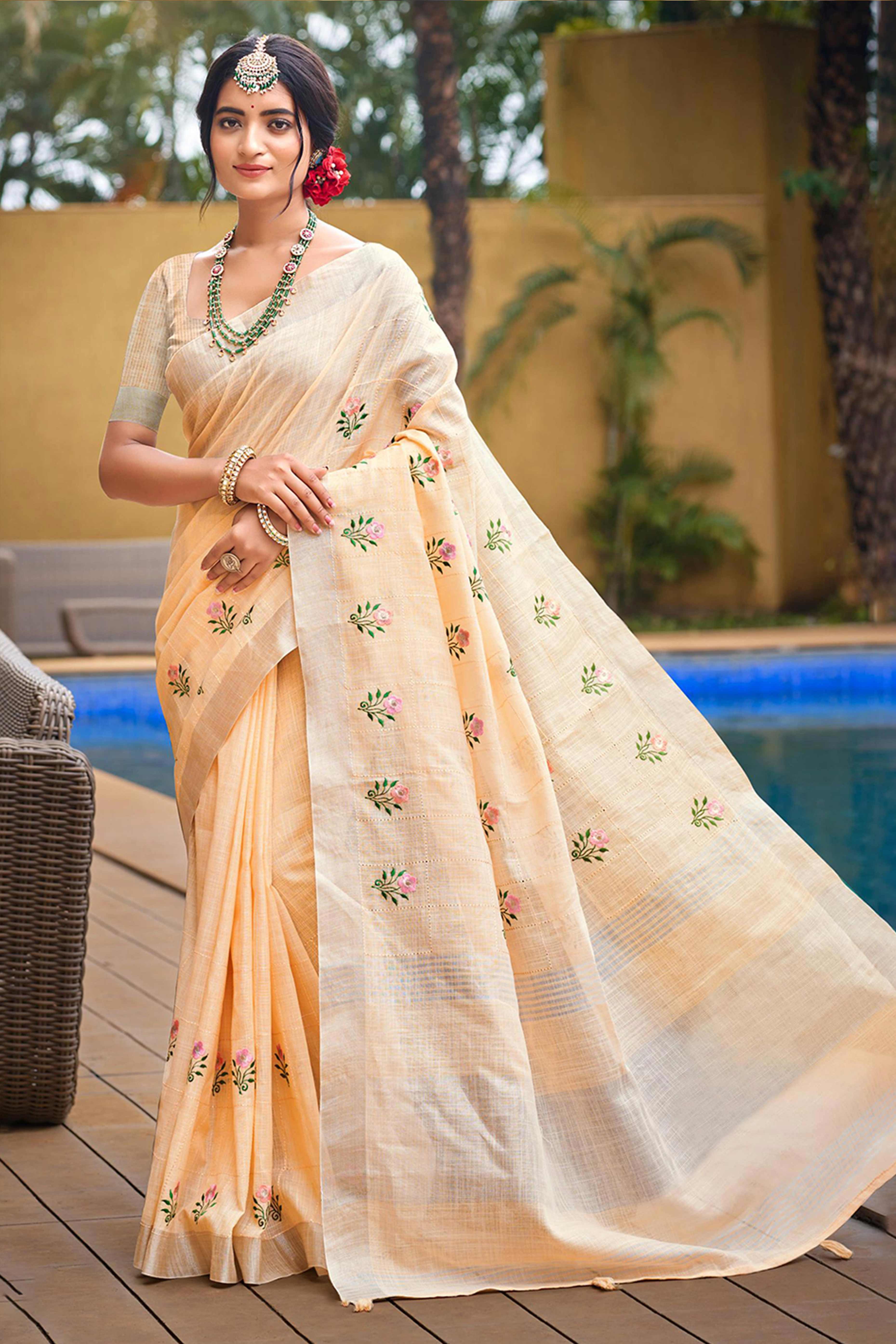 Captivating Light Peach Floral Thread Embroidered Linen Saree With Elegant Weaving Border