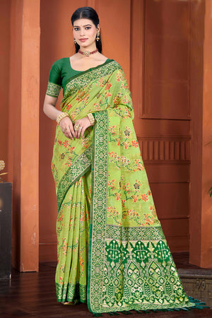 Stunning Green Floral Zari Weaving Cotton Silk Meena Saree With Tassel Pallu