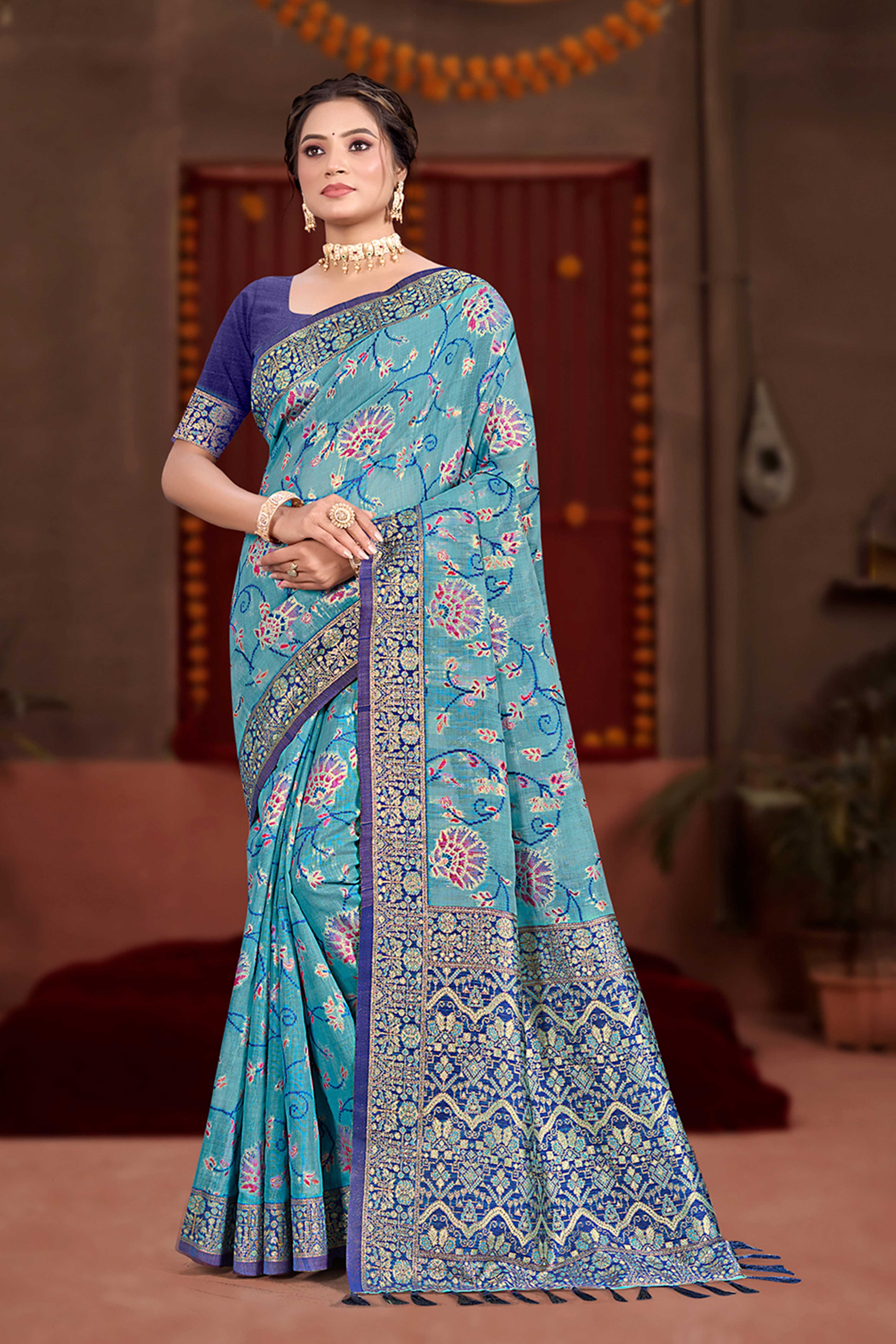 Elegant Blue Cotton Silk Saree Adorned With Floral Weaving & Graceful Tassel Pallu