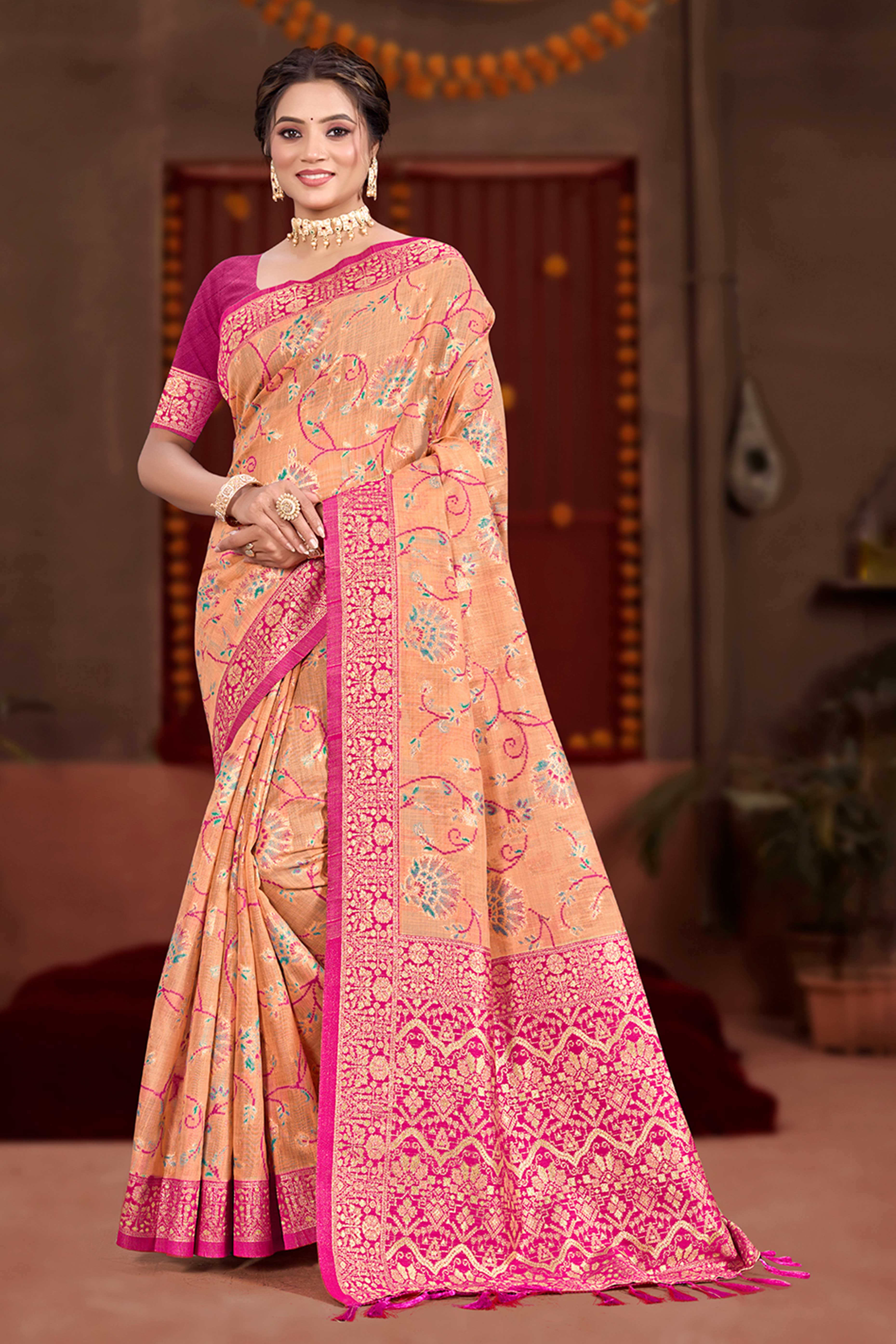 Elegant Light Orange Cotton Silk Saree Adorned With Floral Weaving & Graceful Tassel Pallu