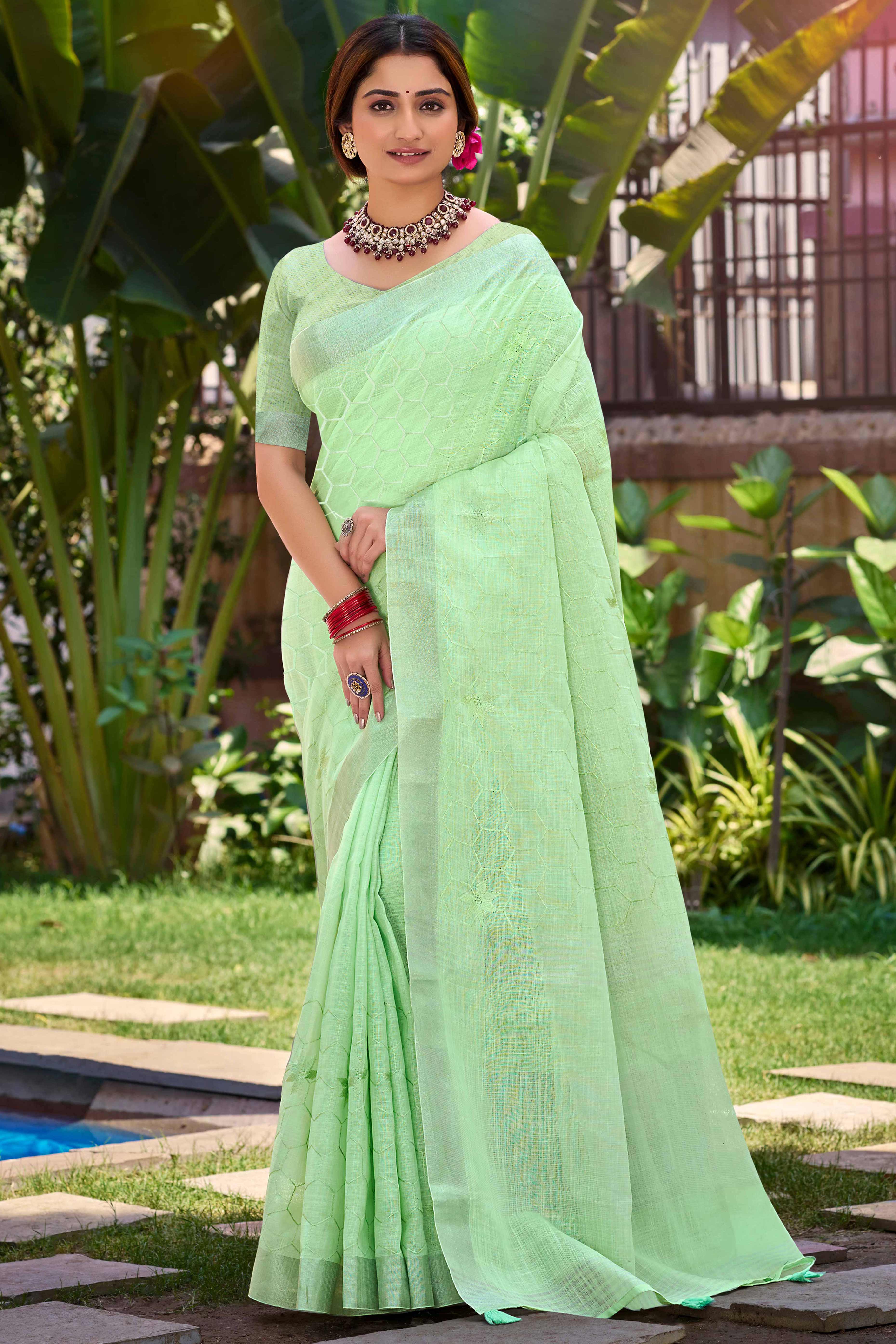 Light Green Classic Linen Saree Enhanced With Fine Geometric Embroidery Work & Tassel Pallu