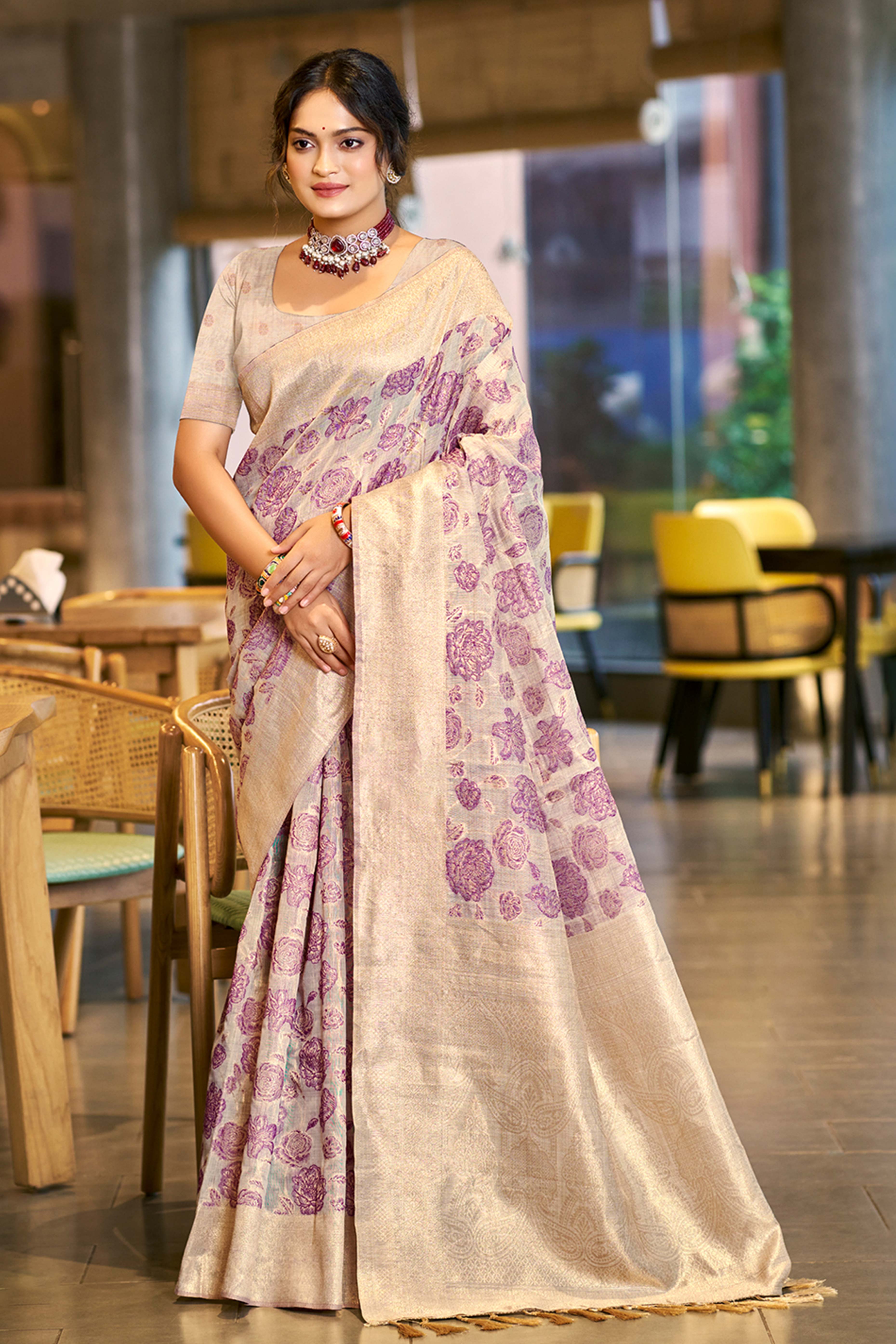 Purple Premium Cotton Silk Saree Highlighted With Floral Weaving Work & Tassel Pallu