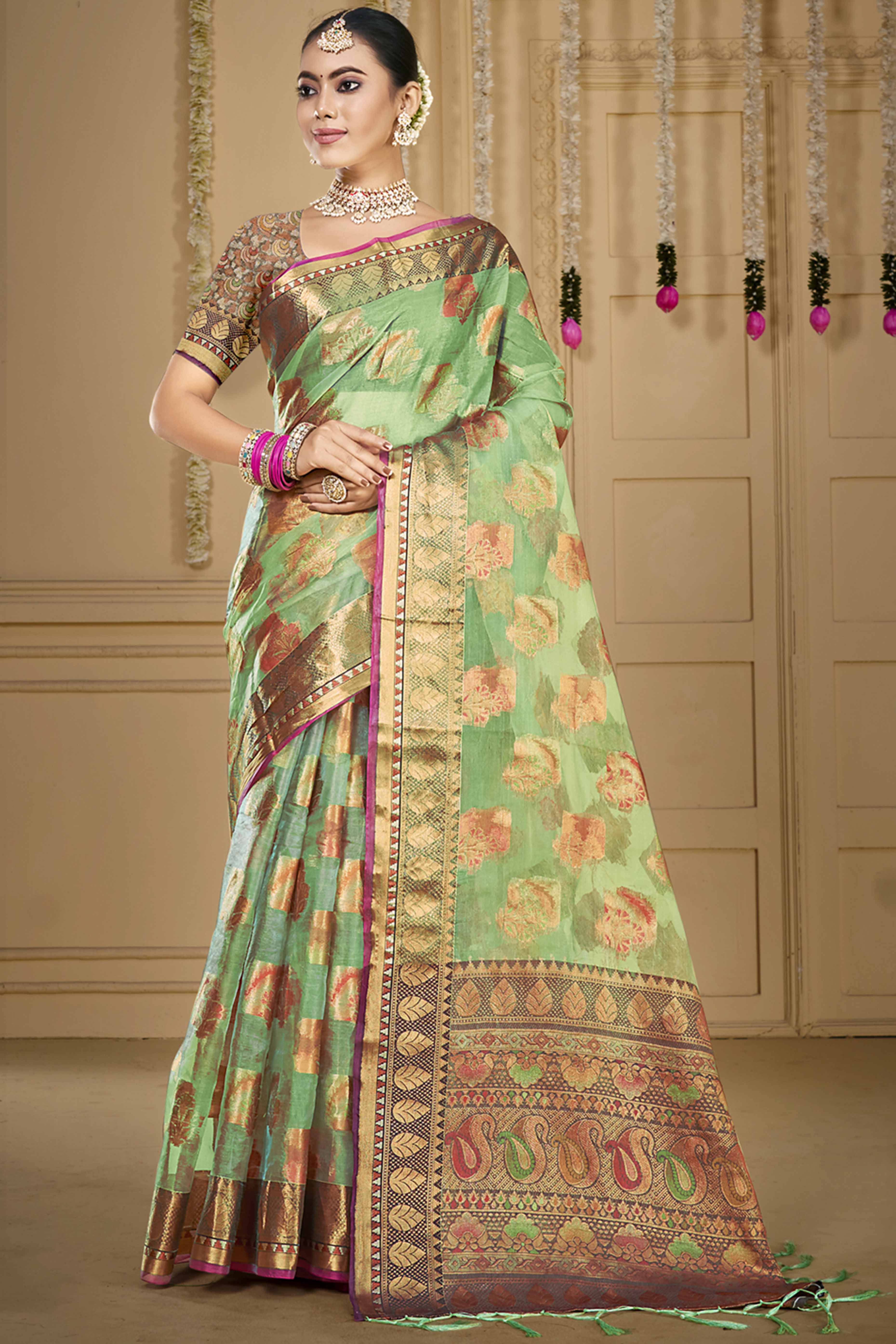 Pista Green Floral Woven Organza Saree With Tassels