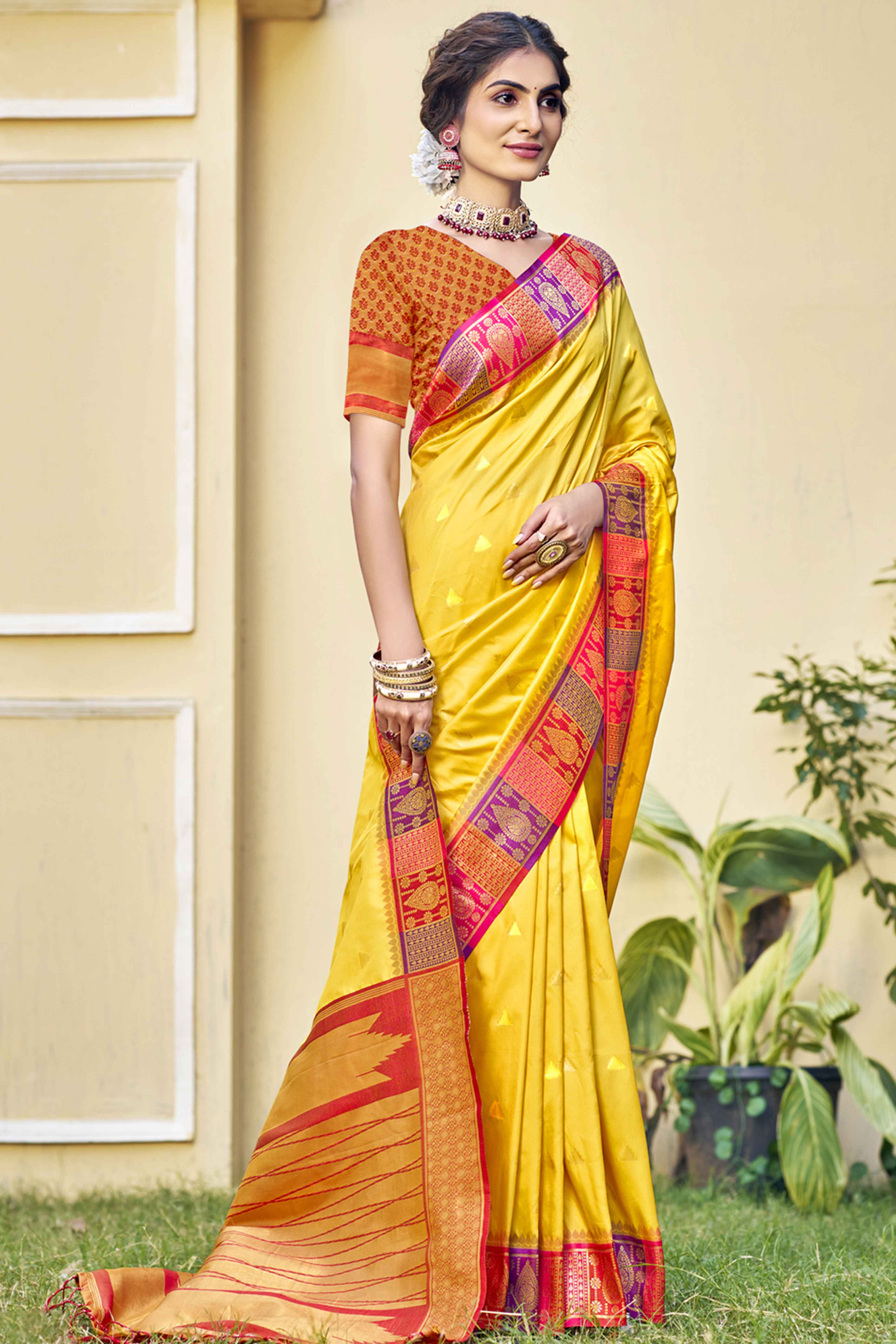 Yellow Woven Banarasi Silk Saree With Tassels