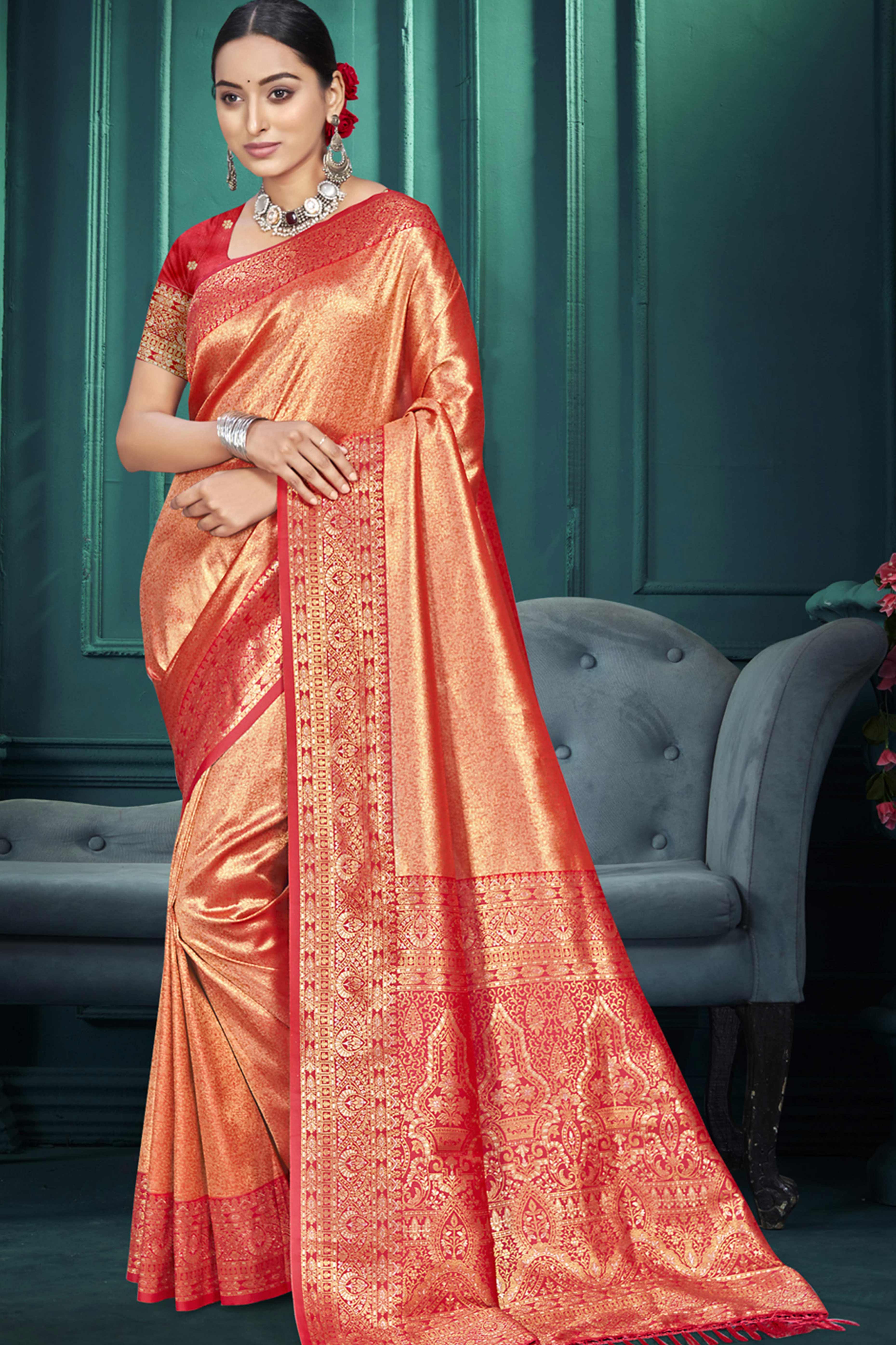 Exclusive Orange Floral Motif Woven Kanjivaram Silk Saree With Graceful Tassel Pallu