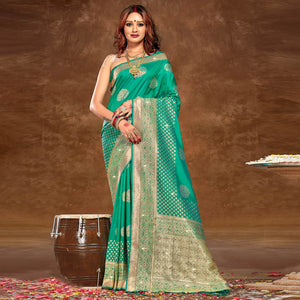 Turquoise Floral Woven Banarasi Silk Saree With Tassels