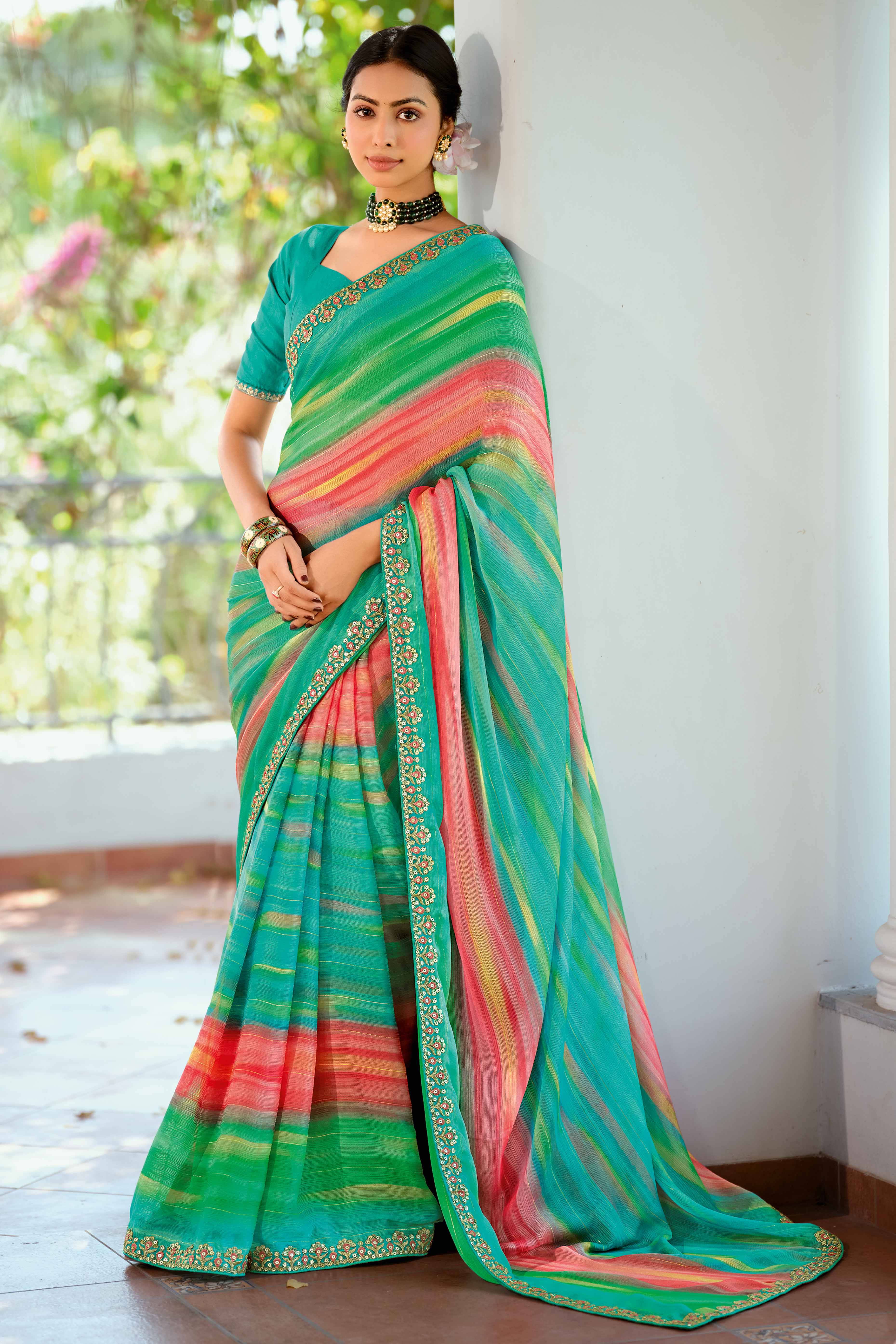 Festive Turquoise Georgette Saree with Dazzling Sequin Work Border