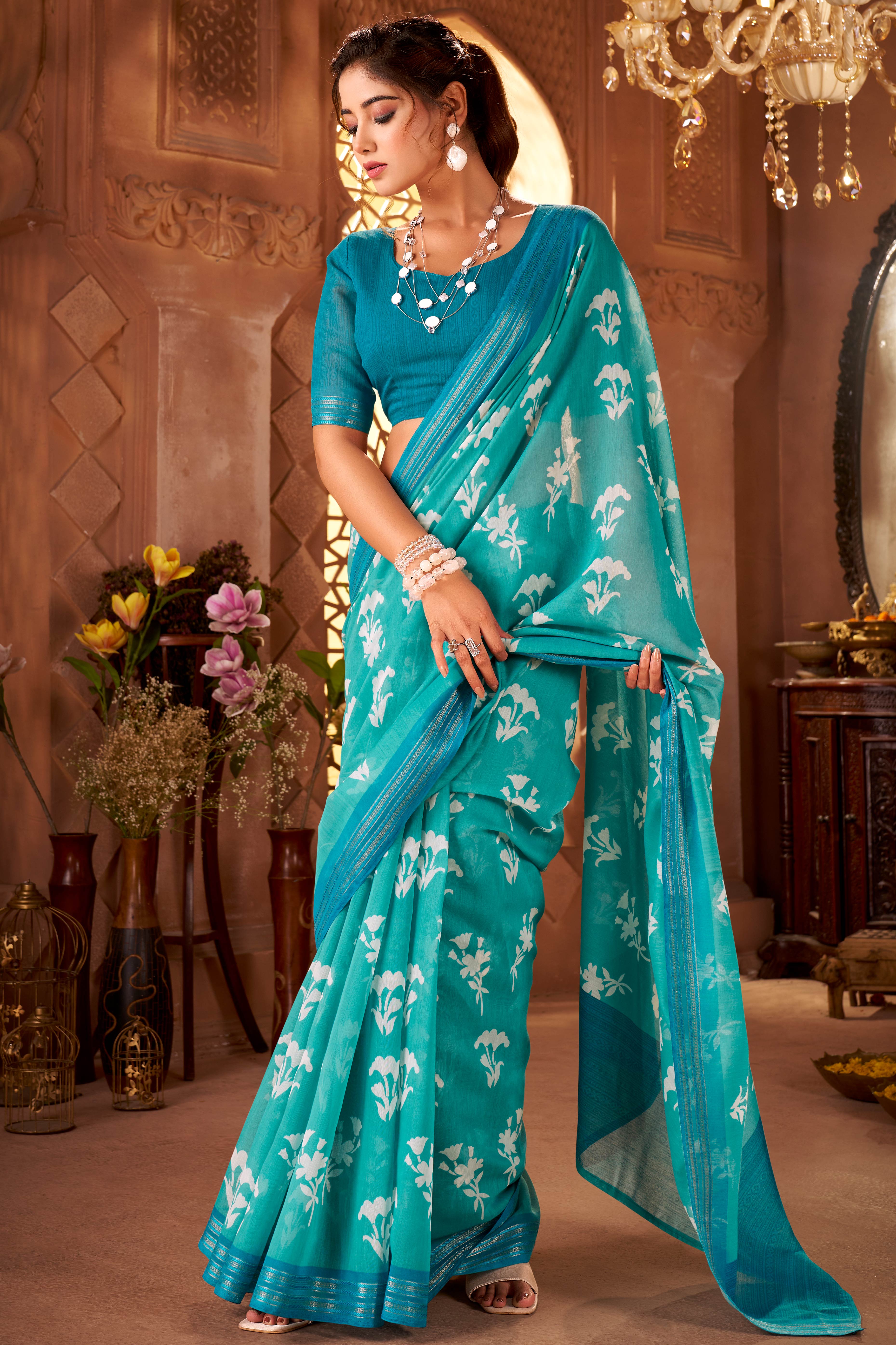 Sophisticated Turquoise Mulmul Cotton Saree Featuring Delicate Floral Prints & Weaving Border