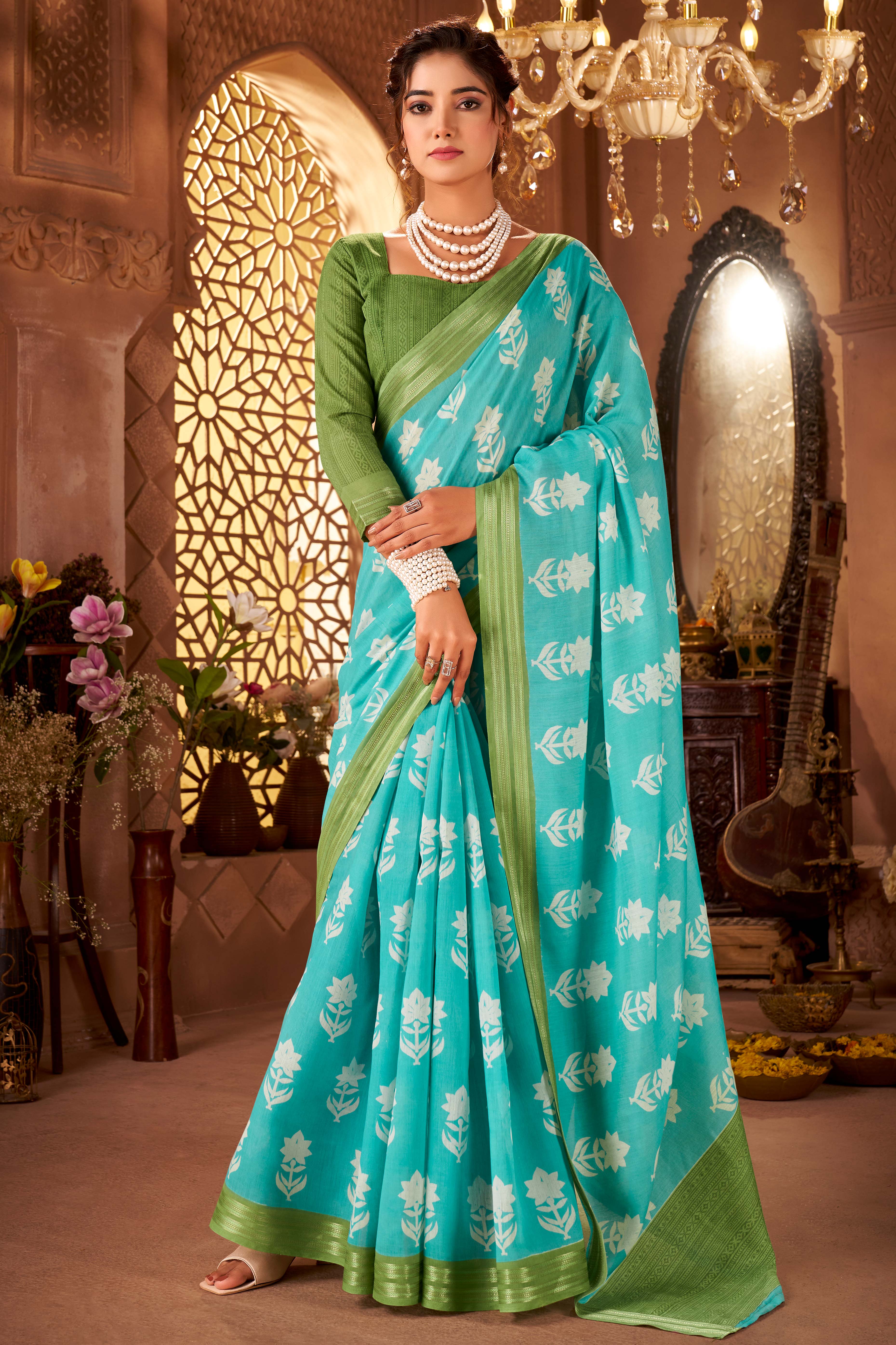 Sophisticated Blue Mulmul Cotton Saree Featuring Delicate Floral Prints & Weaving Border