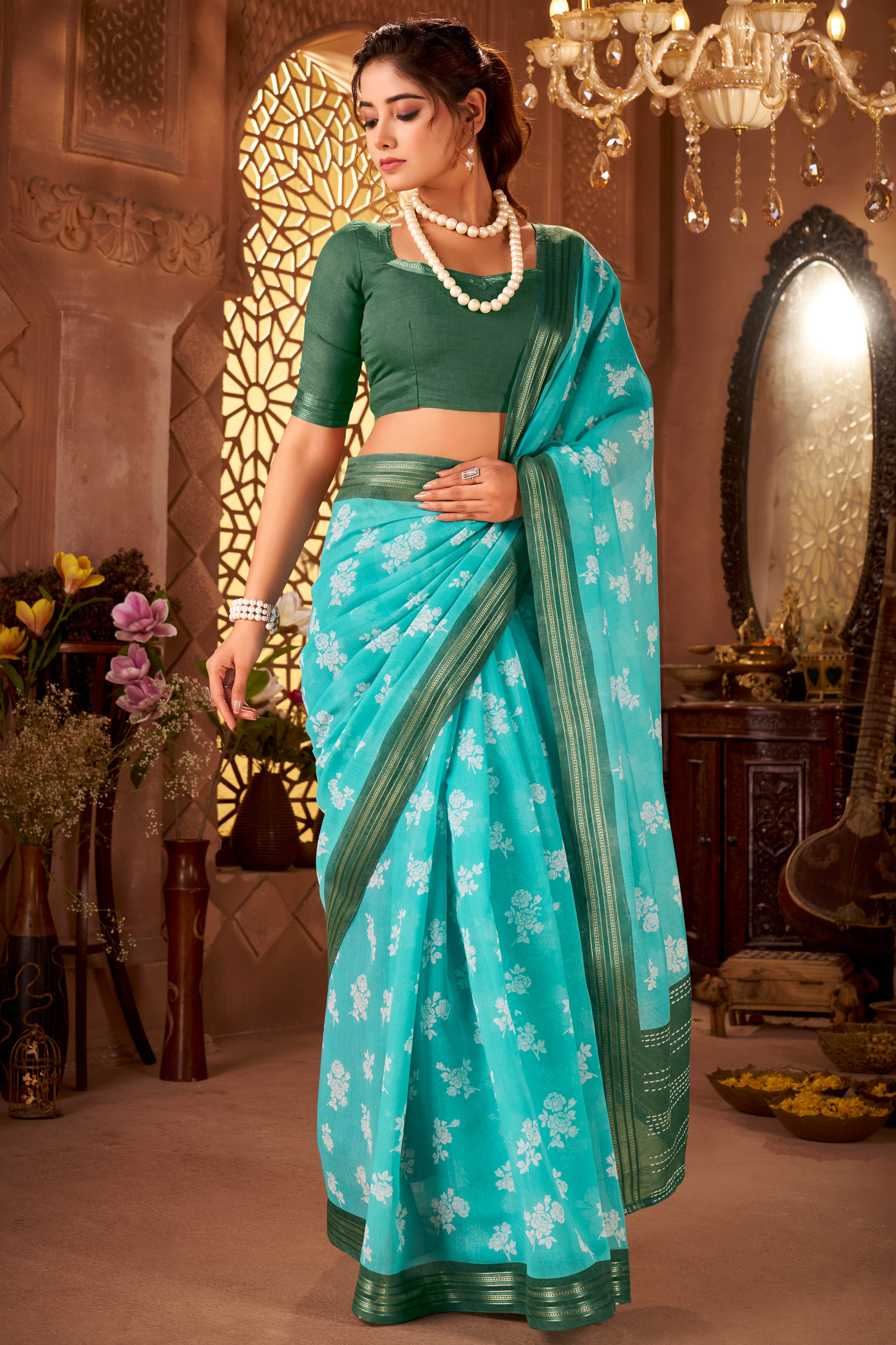 Sophisticated Turquoise Mulmul Cotton Saree Featuring Delicate Floral Prints & Weaving Border
