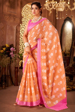 Sophisticated Peach Mulmul Cotton Saree Featuring Delicate Floral Prints & Weaving Border
