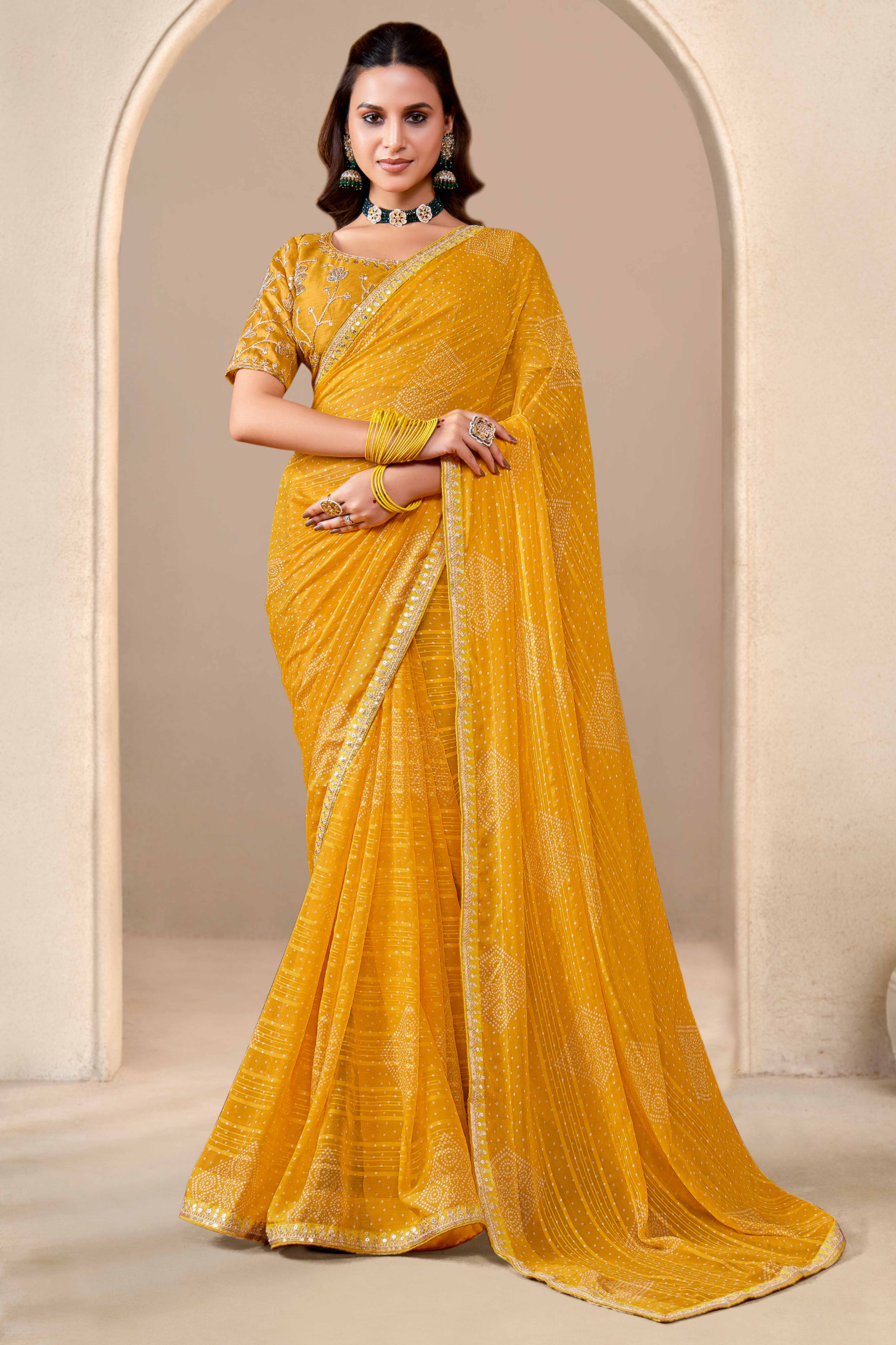 Mustard Bandhani Printed Georgette Saree Enhanced With Sequins & Cording Embroidered Lace Border