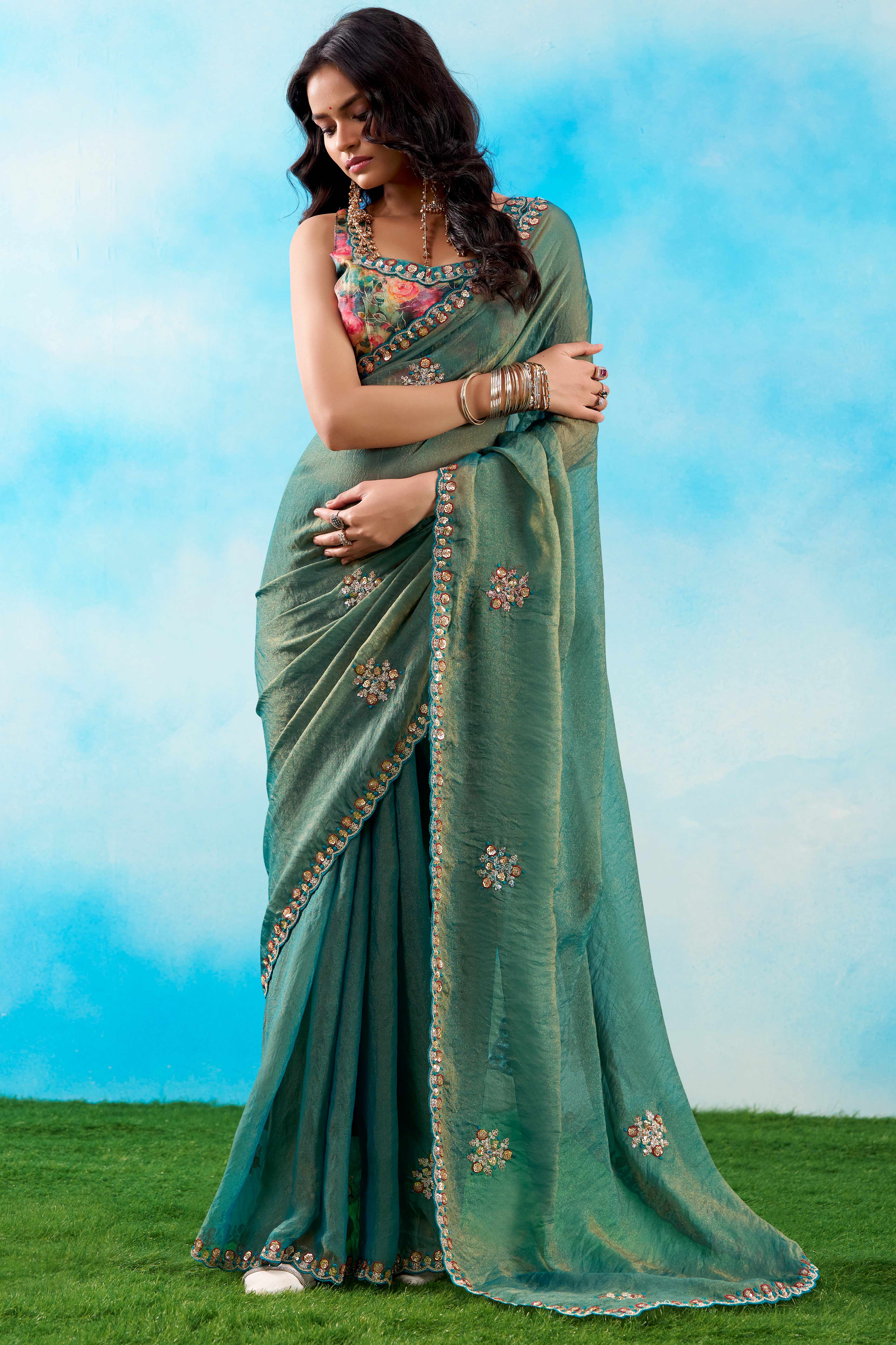 Luxurious Teal Chiffon Saree Showcasing Floral Sequins Embroidery In A Two Tone Finish