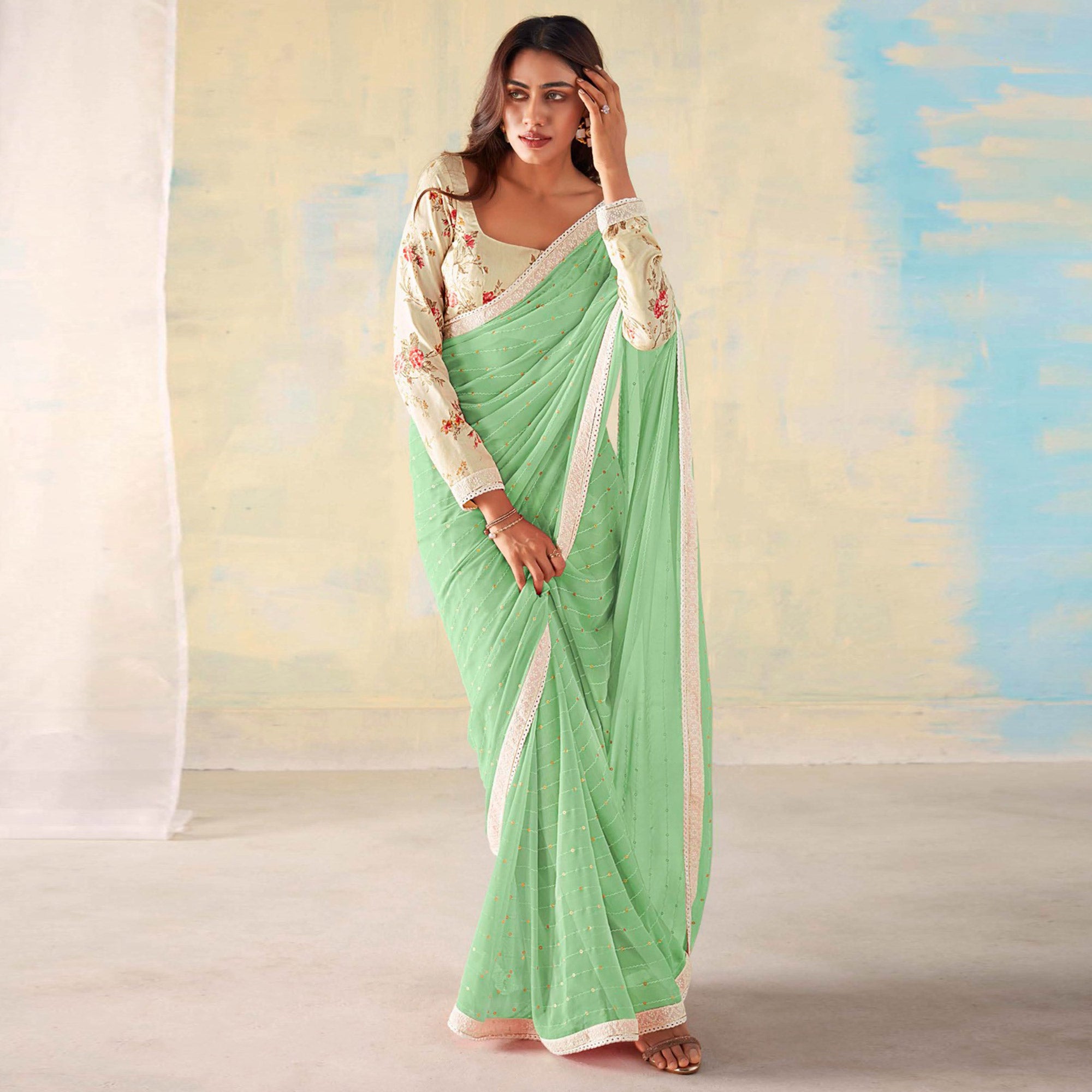 Sea Green Foil Printed Georgette Saree With Embroidered Border