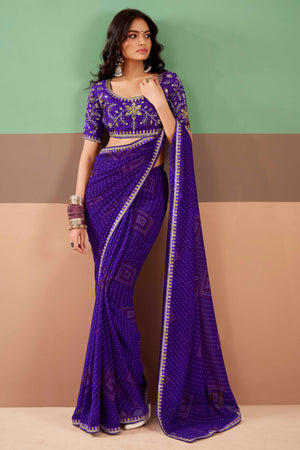 Charming Purple Bandhani Printed Georgette Saree Adorned With Intricate Cording Embroidered Border
