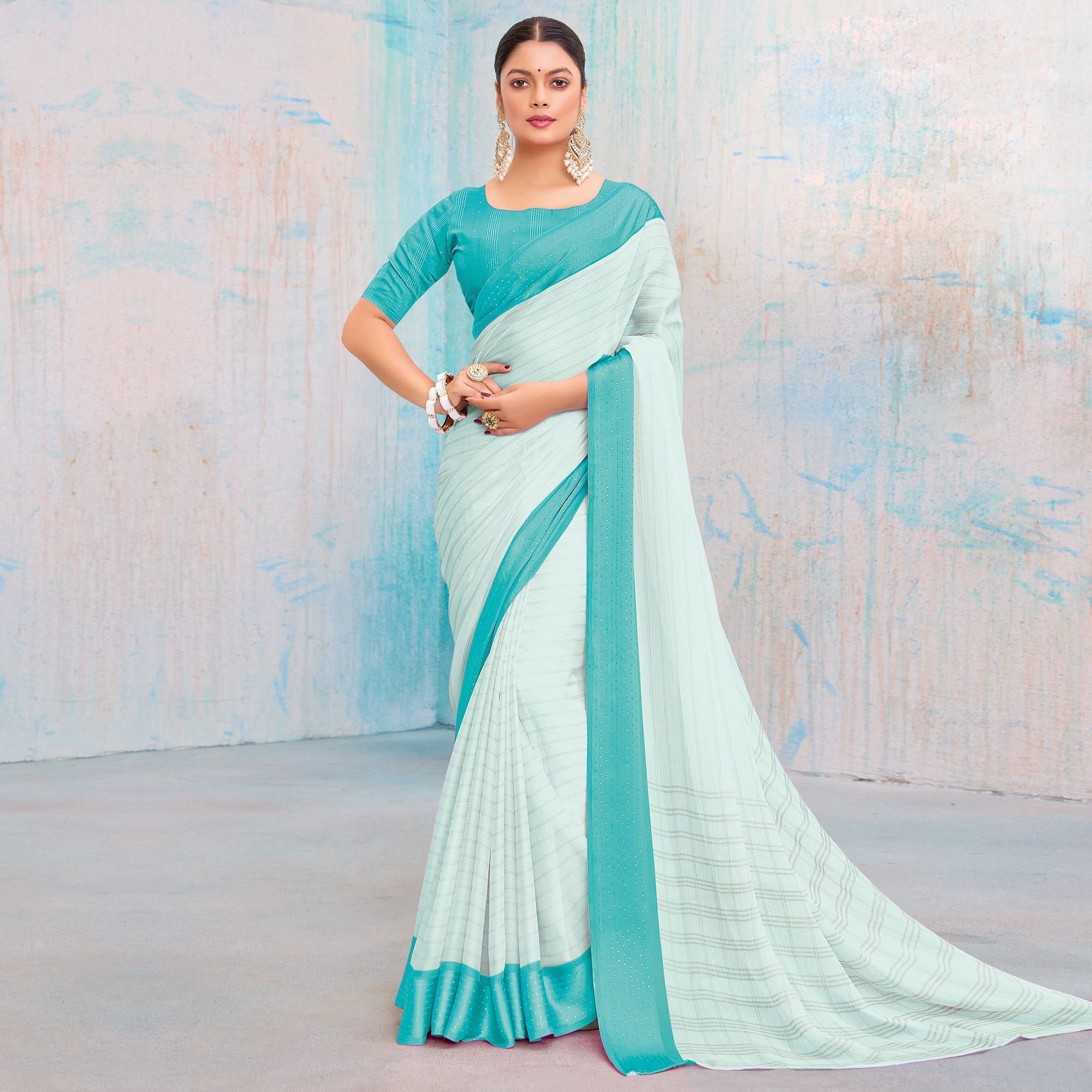 Turquoise Printed Chiffon Saree With Weaving Border