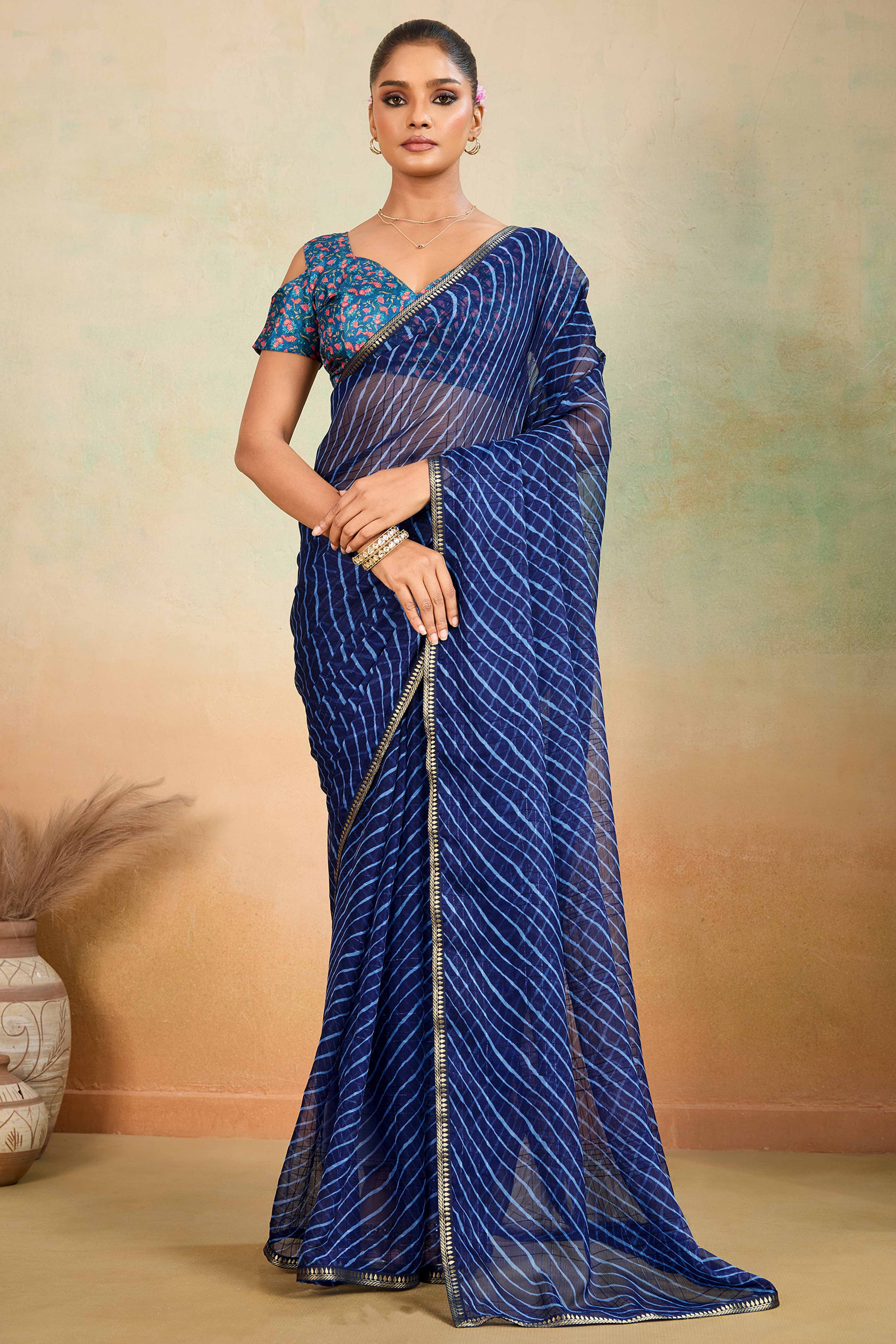 Blue Leheriya Chiffon Saree Accented With Elegant Zari Lace Border Work