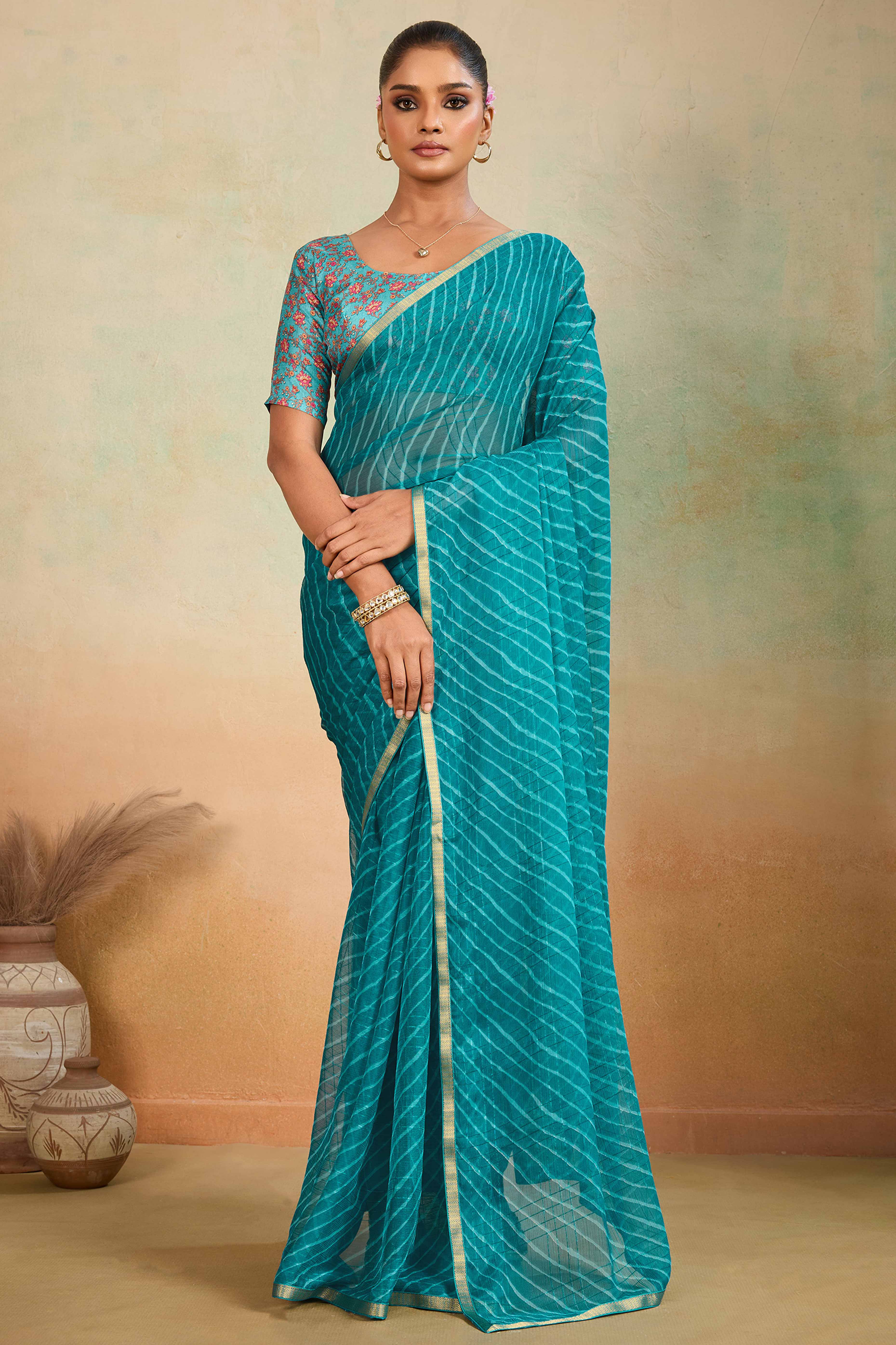 Teal Leheriya Chiffon Saree Accented With Elegant Zari Lace Border Work