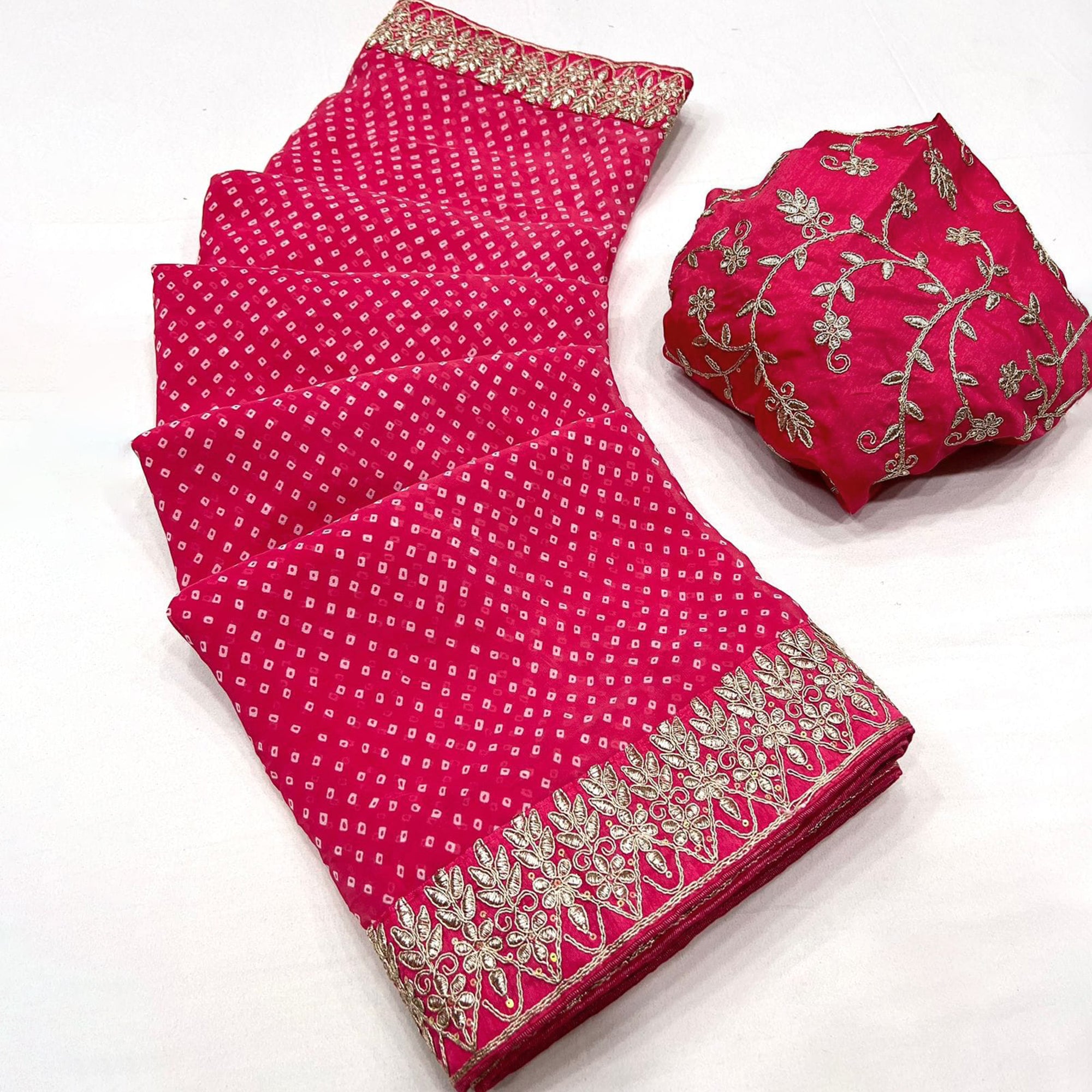 Pink Lightweight Georgette Saree Adorned with Classic Bandhani Prints and Lace Work