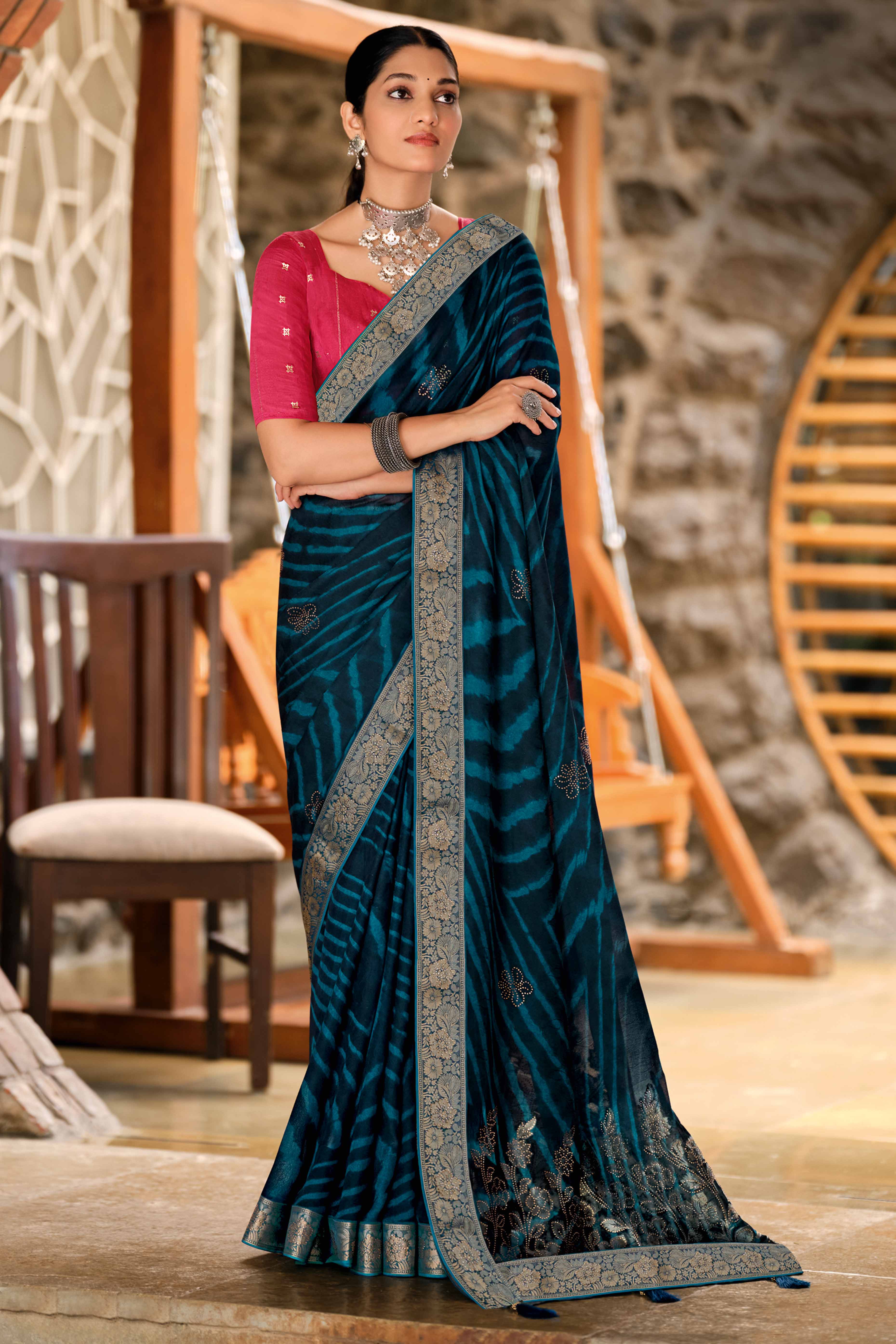 Morpich Blue Abstract Printed Georgette Saree Enhanced with Subtle and Shiny Stone Work