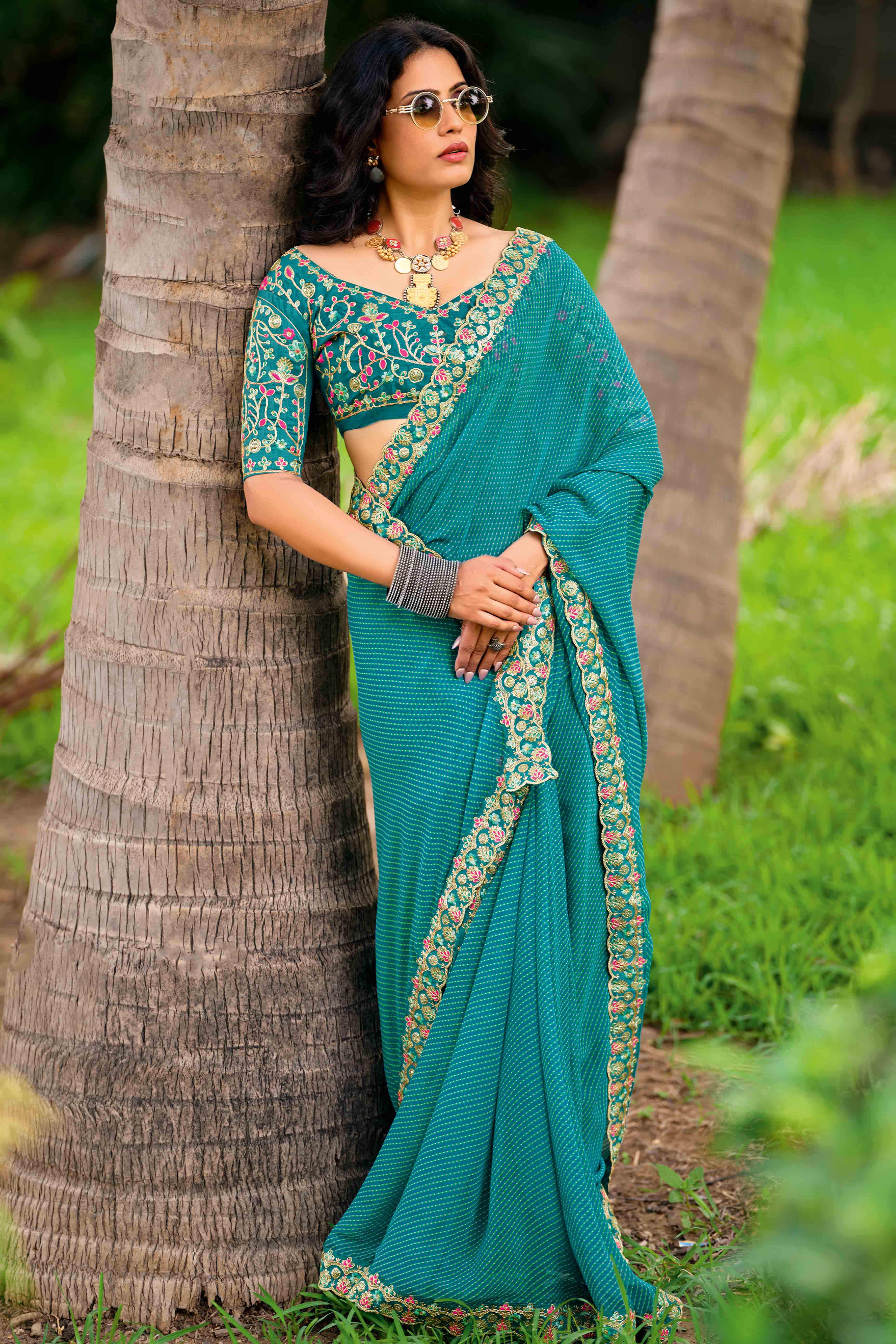 Rama Blue Striped Printed Georgette Saree With Shimmering Sequin Embroidered Border