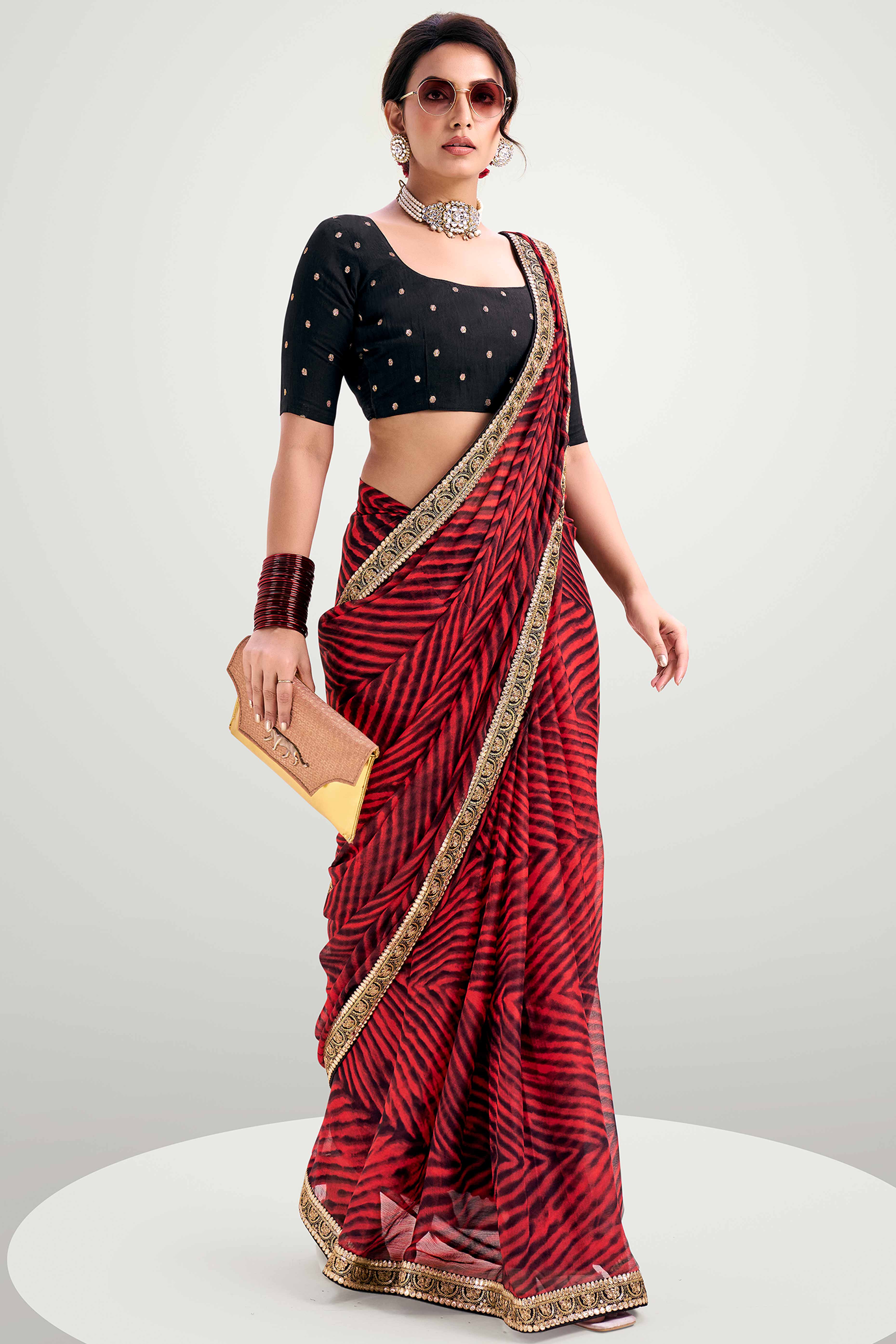 Red Striped Printed Chiffon Saree Enhanced With Sparkling Sequins Embroidered Border Work