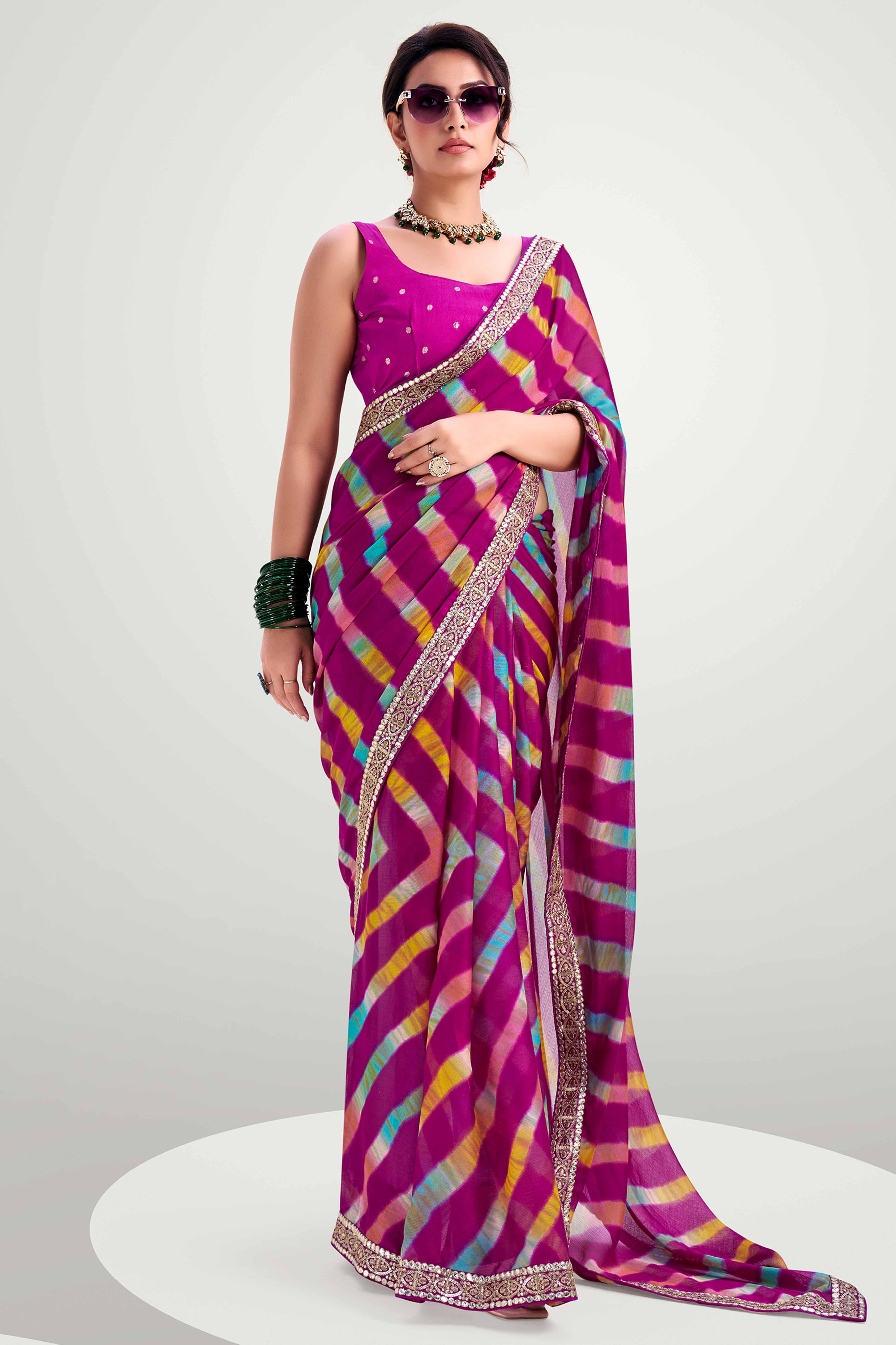 Purple Striped Printed Chiffon Saree Enhanced With Sparkling Sequins Embroidered Border Work