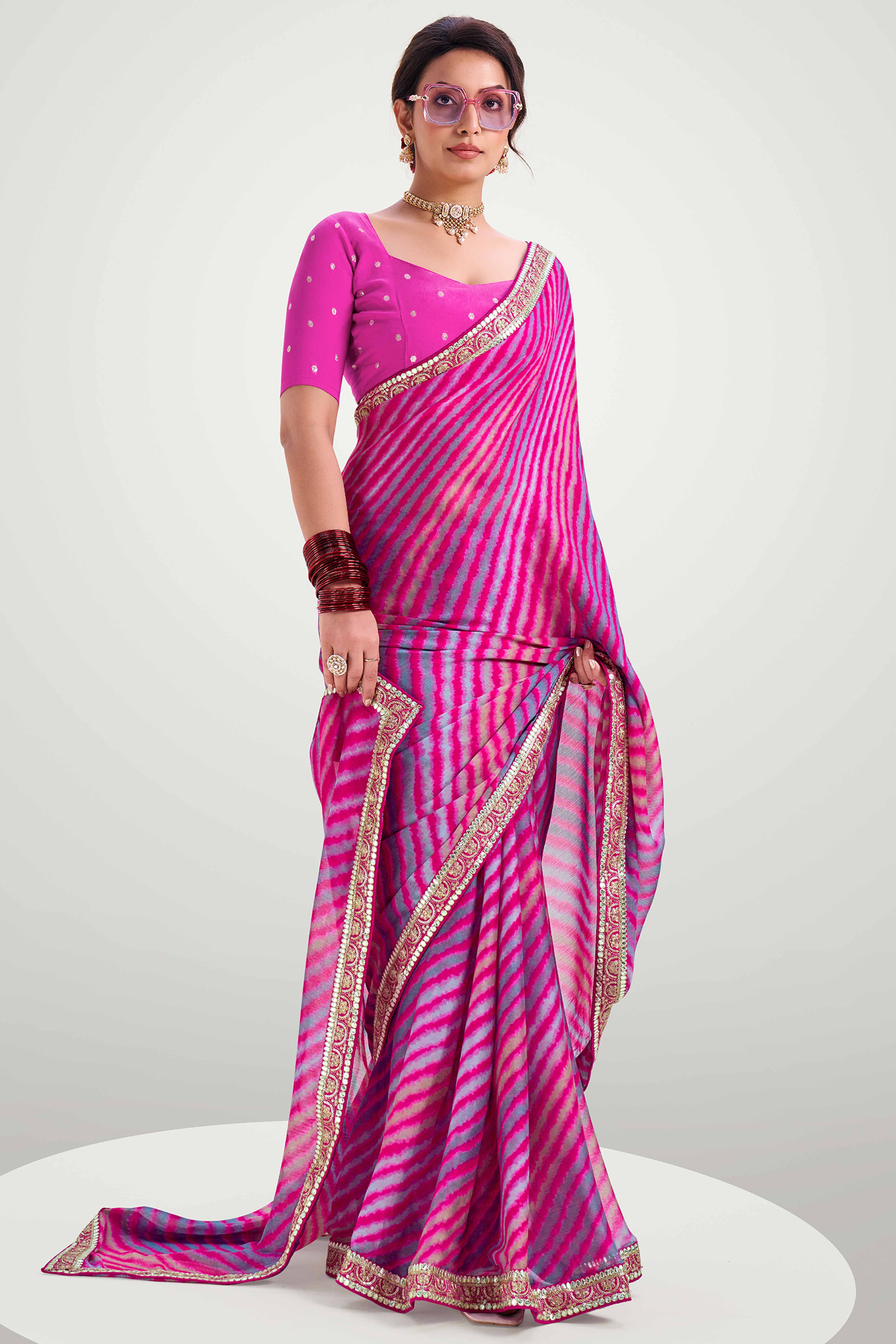 Rani Pink Striped Printed Chiffon Saree Enhanced With Sparkling Sequins Embroidered Border Work