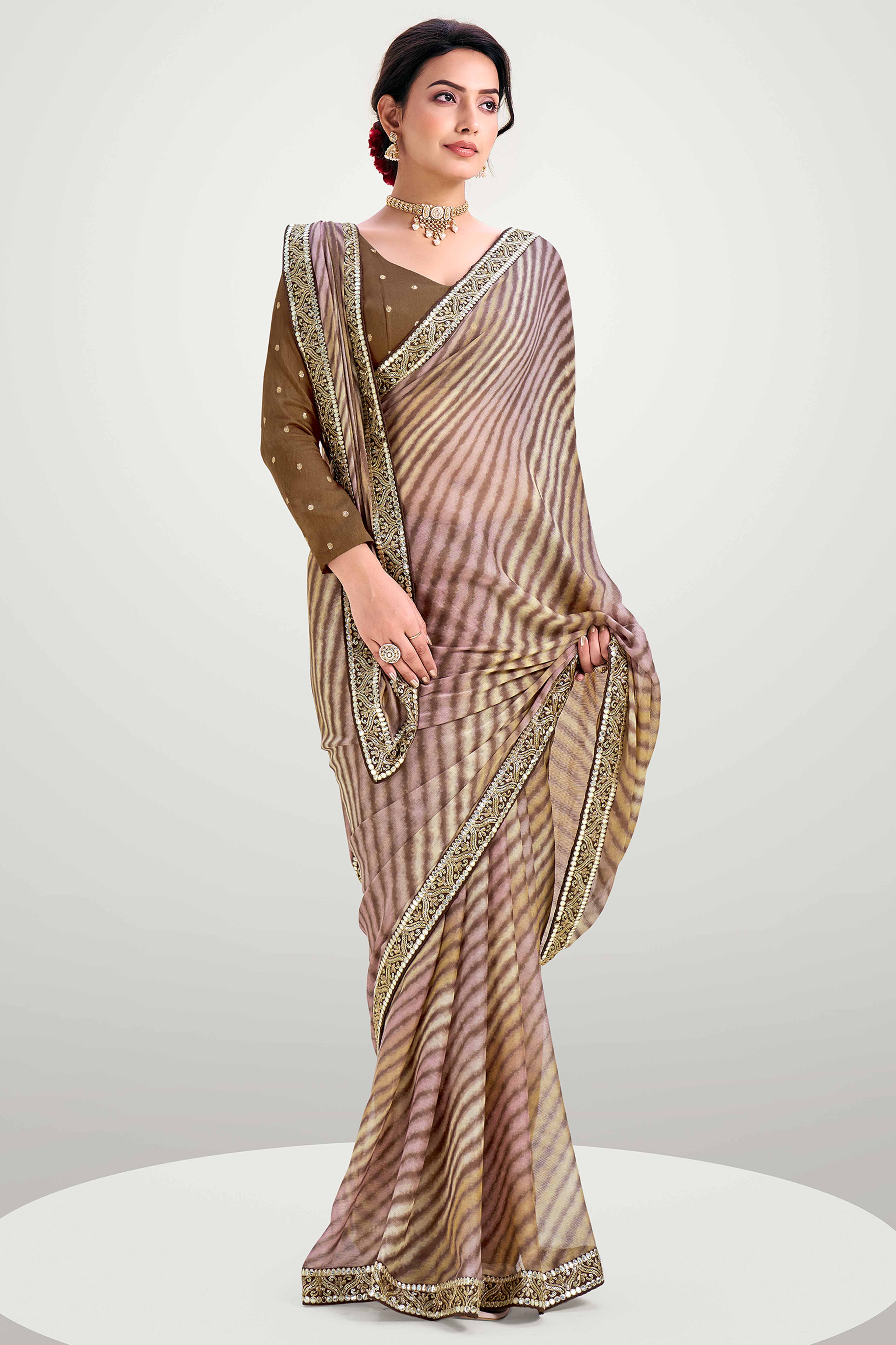 Brown Striped Printed Chiffon Saree Enhanced With Sparkling Sequins Embroidered Border Work