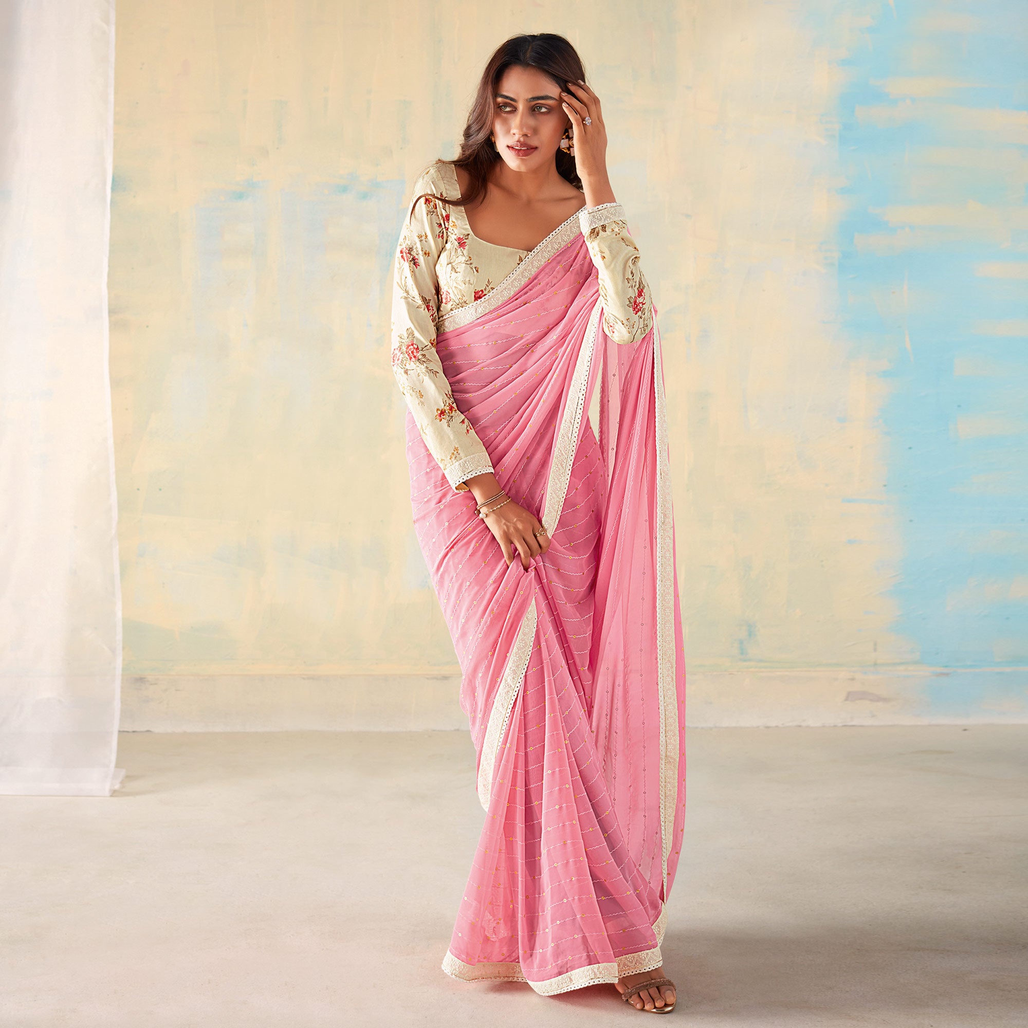Pink Foil Printed Georgette Saree With Tassels