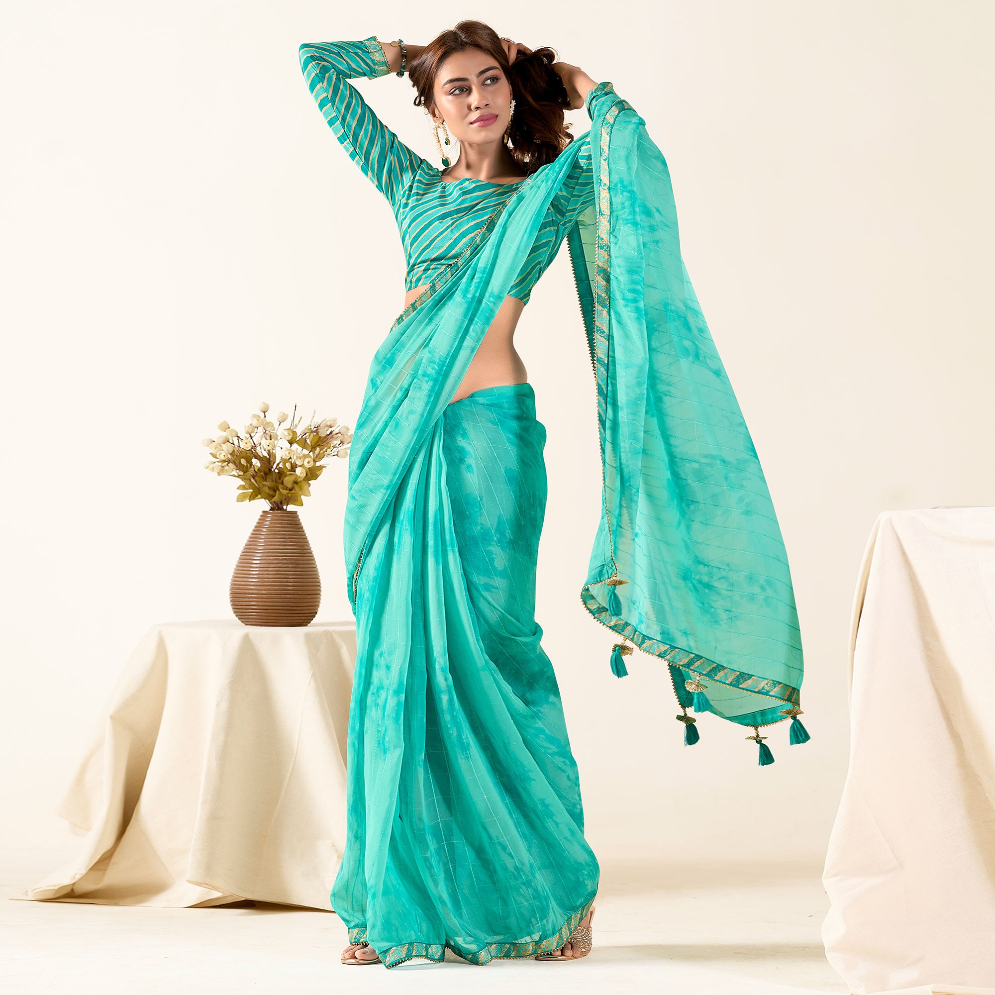Turquoise Printed With Woven Georgette Saree With Tassels