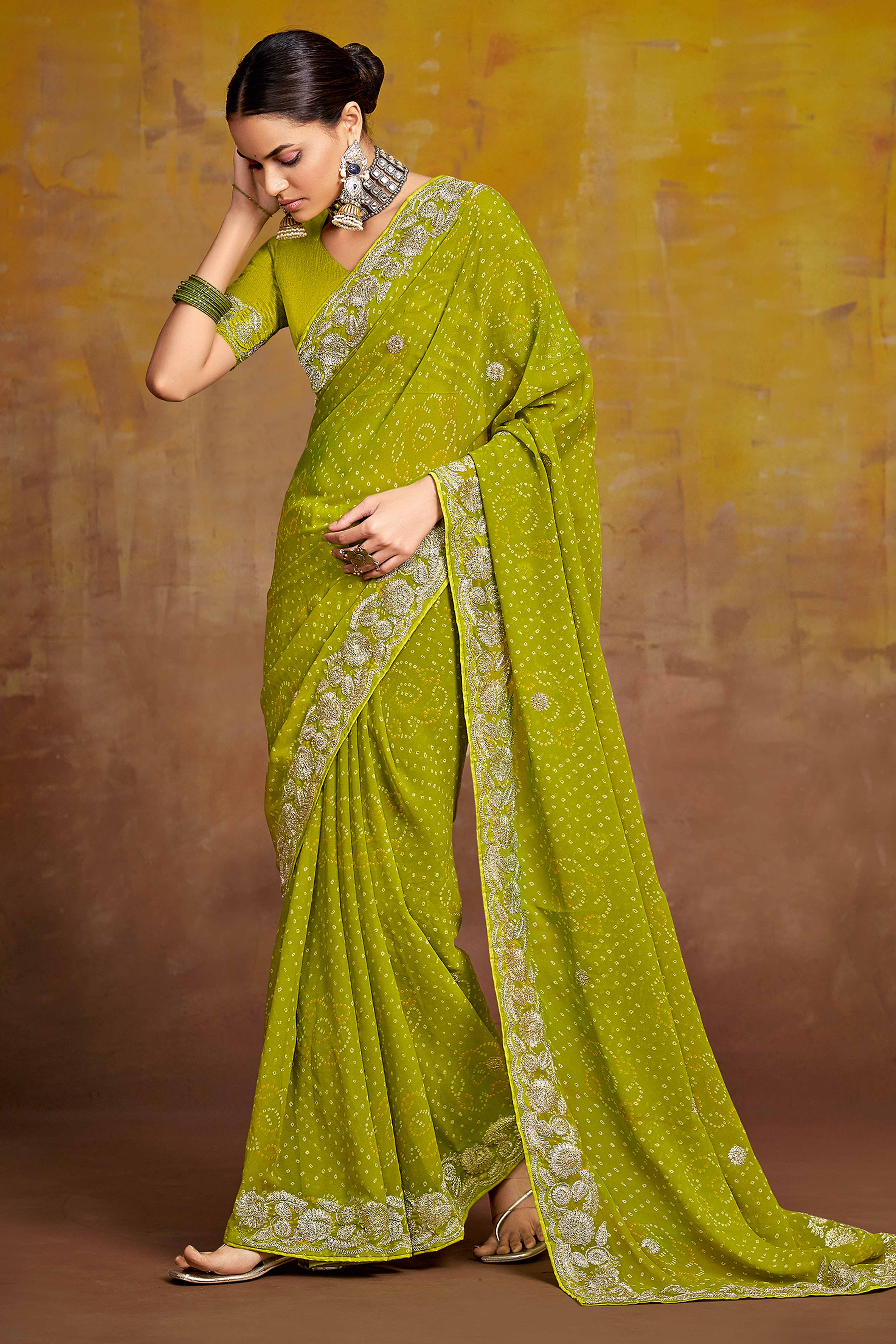 Green Georgette Saree Adorned With Traditional Bandhani Prints & Intricate Floral Embroidery